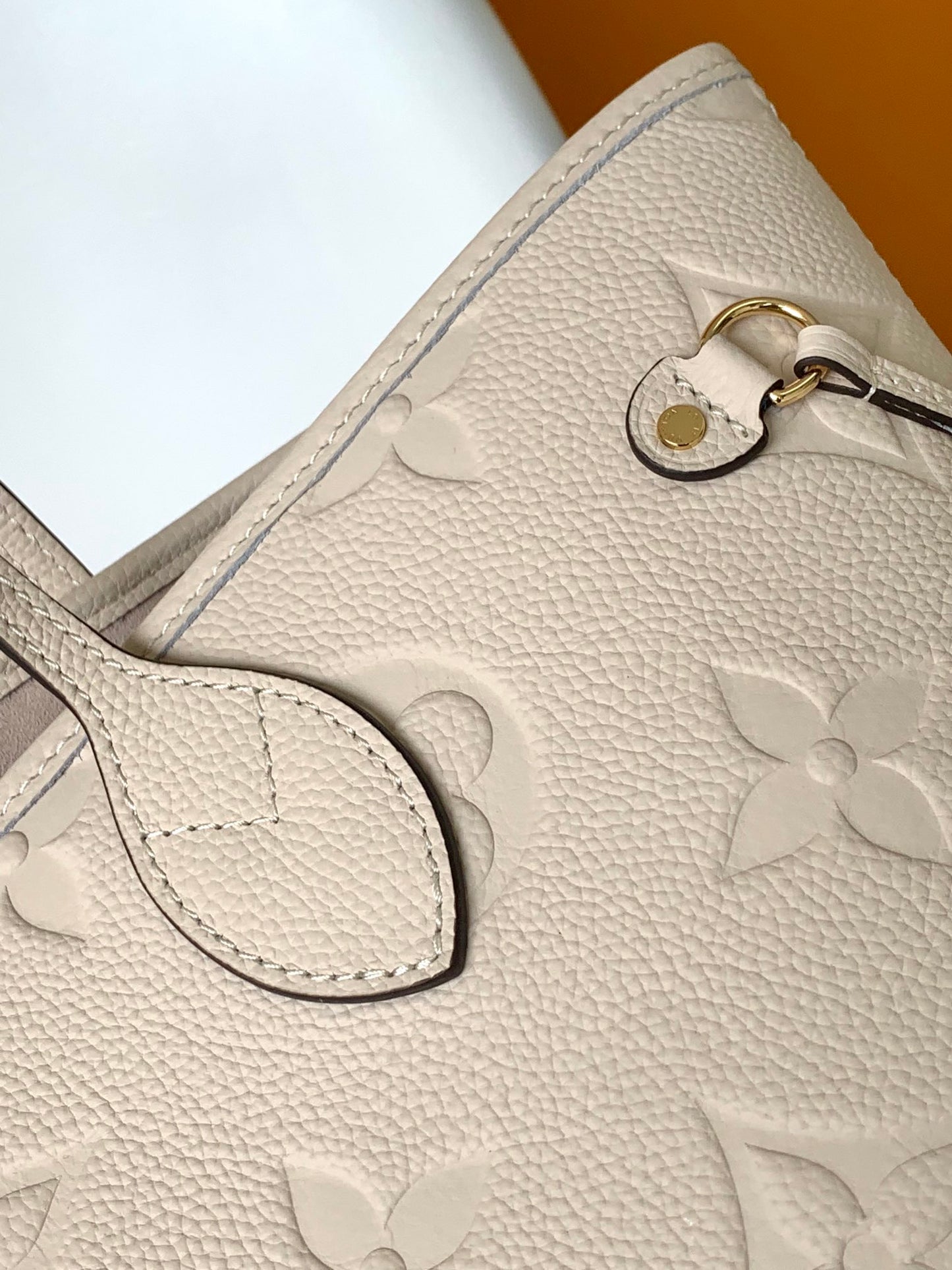 Louis Vuitton Elegant Beige Embossed Leather Tote Bag with Side Drawstrings