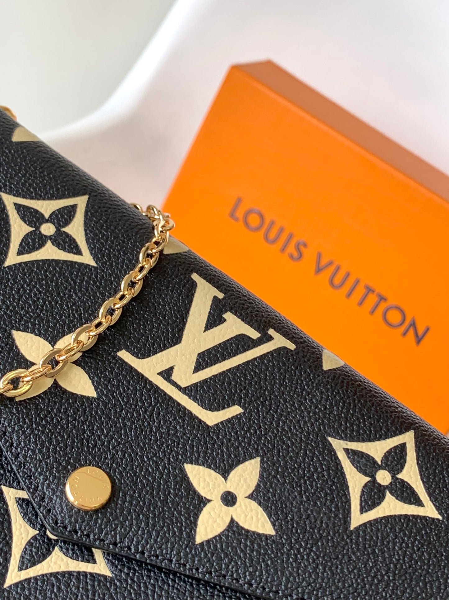 Louis Vuitton Elegant Black Chain Shoulder Bag with Gold Monogram Print