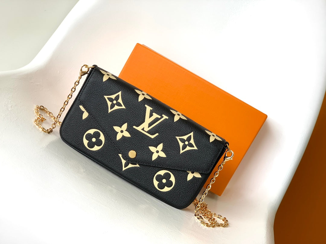 Louis Vuitton Elegant Black Chain Shoulder Bag with Gold Monogram Print