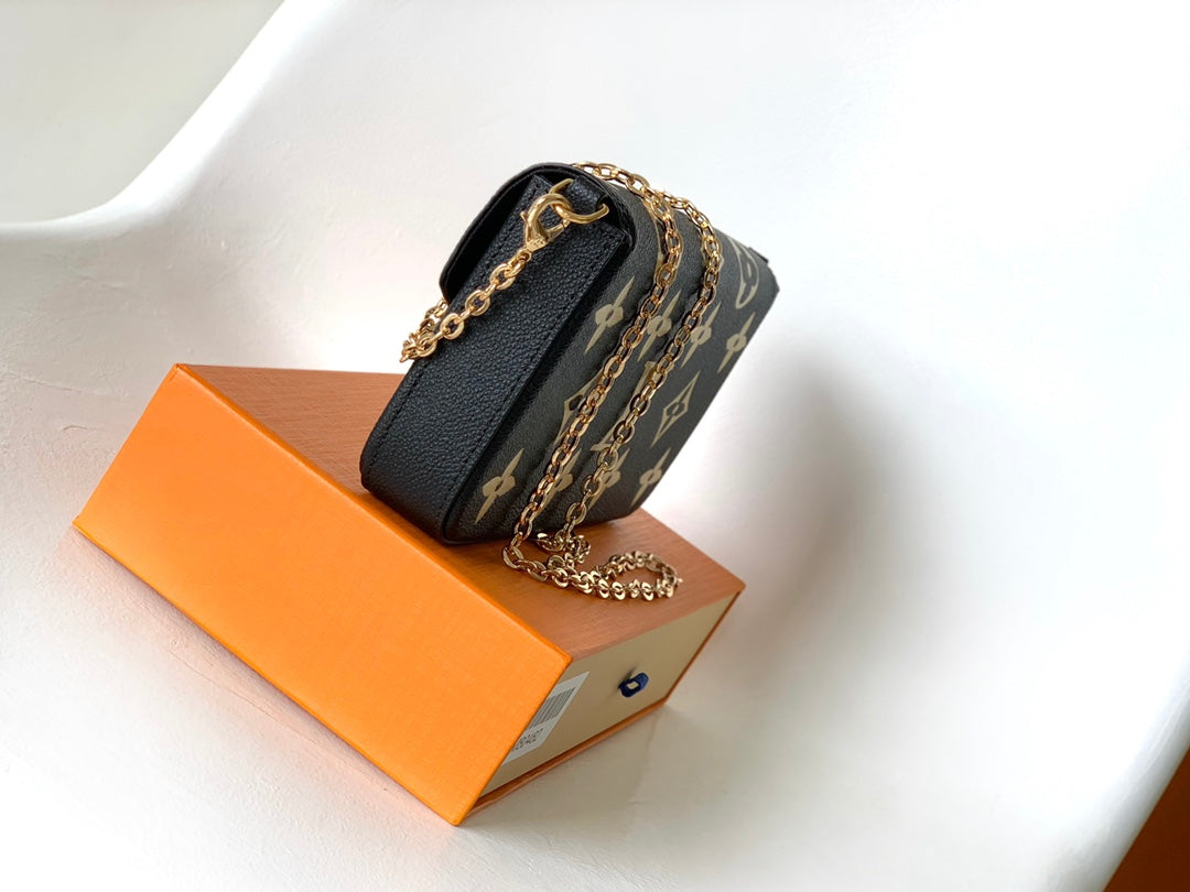 Louis Vuitton Elegant Black Chain Shoulder Bag with Gold Monogram Print