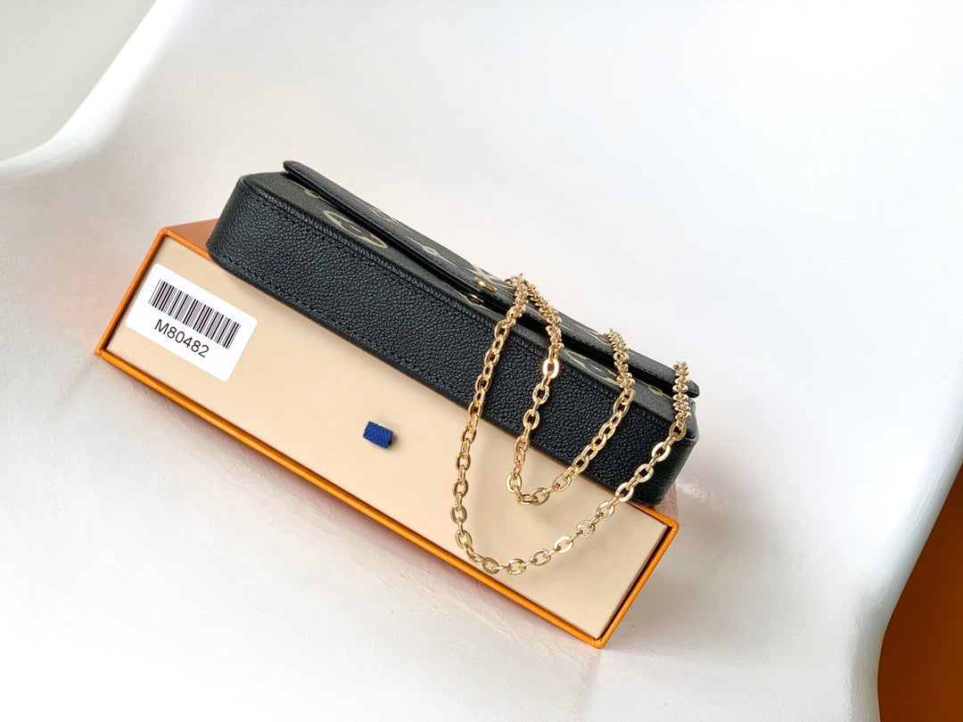 Louis Vuitton Elegant Black Chain Shoulder Bag with Gold Monogram Print
