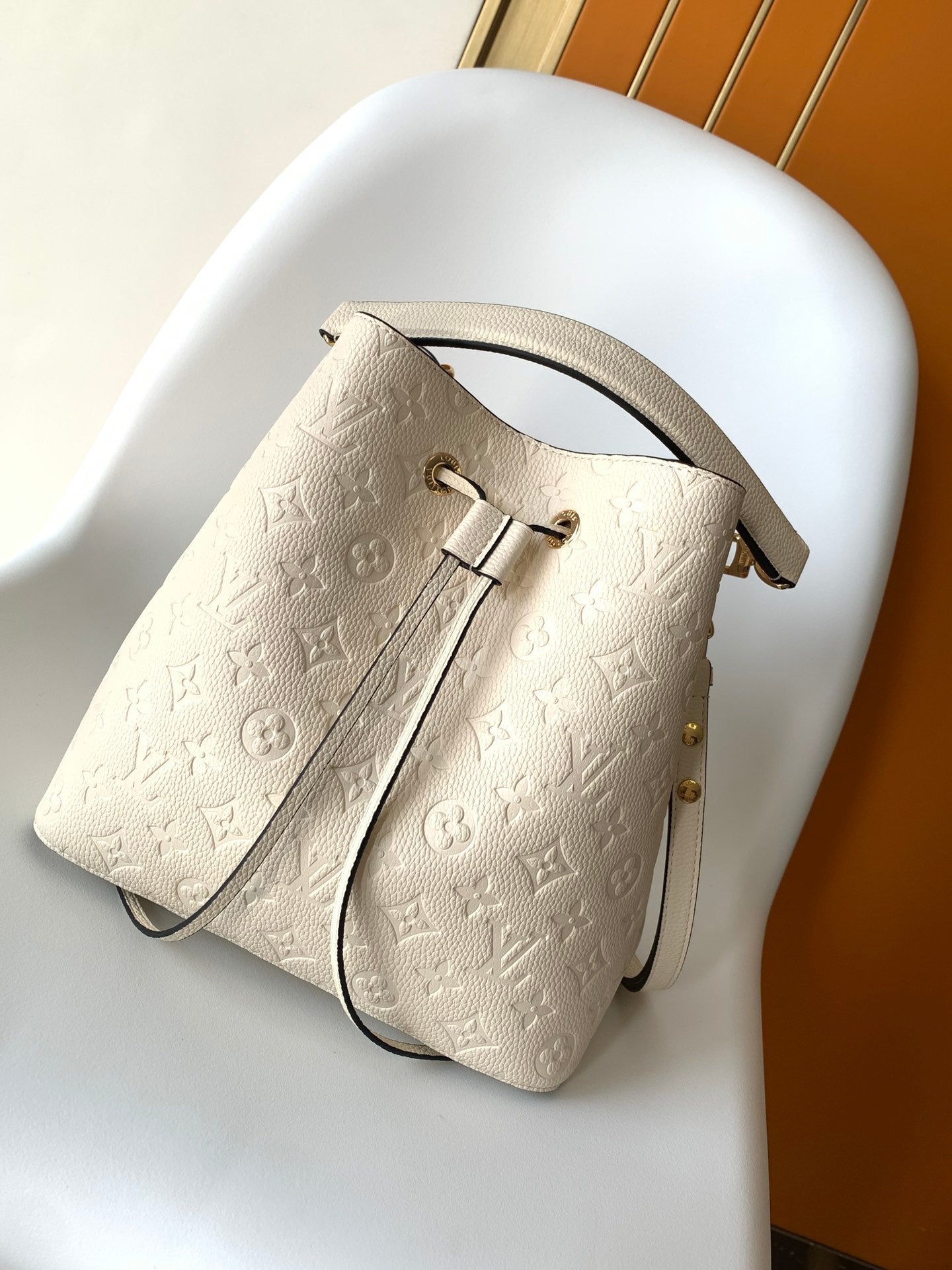 Louis Vuitton Elegant Cream Perforated Leather Drawstring Bucket Bag