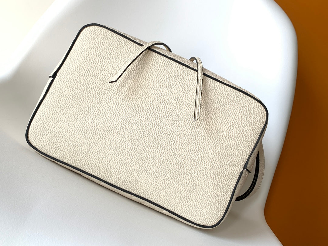 Louis Vuitton Elegant Cream Perforated Leather Drawstring Bucket Bag