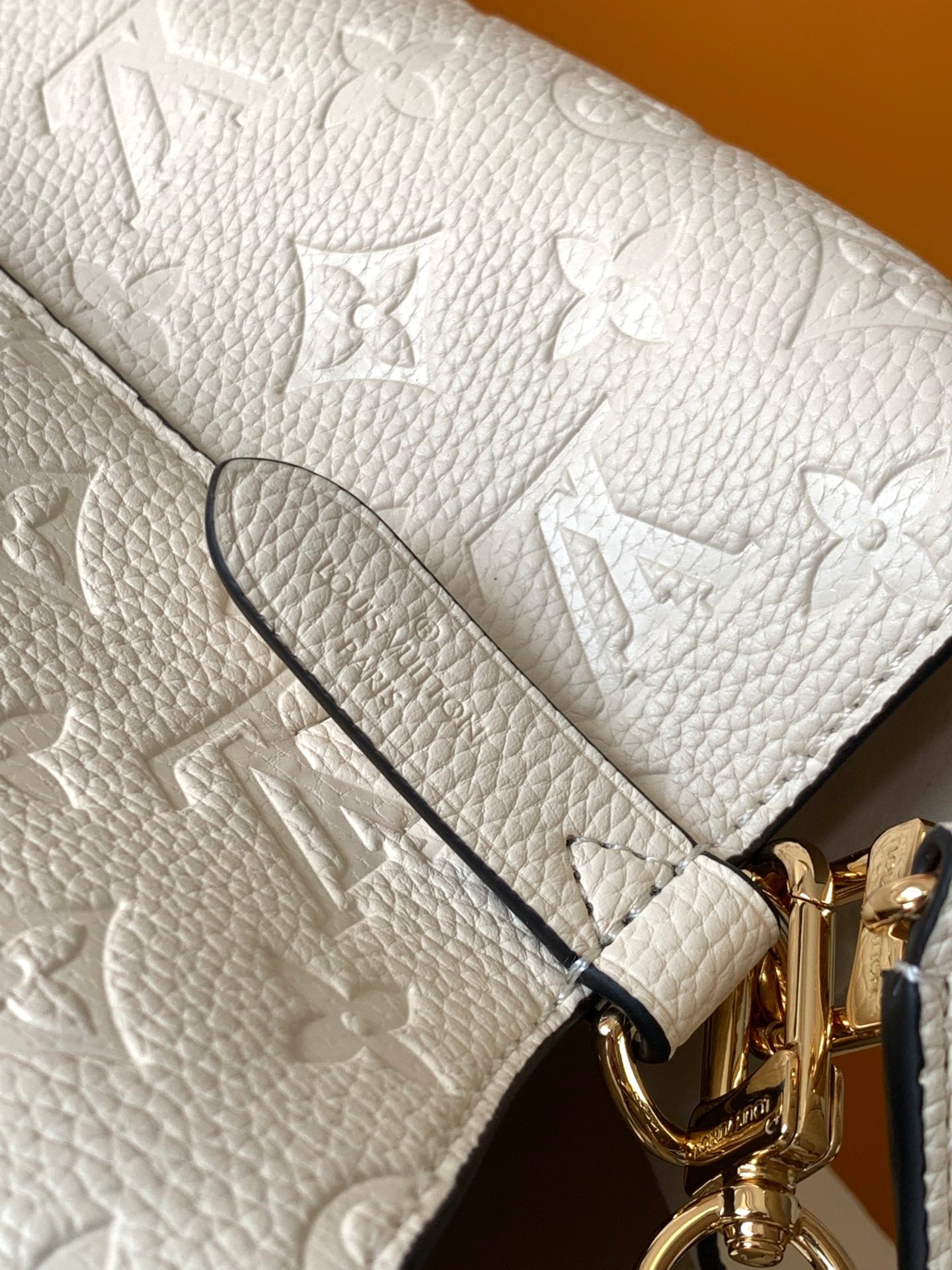 Louis Vuitton Elegant Cream Perforated Leather Drawstring Bucket Bag