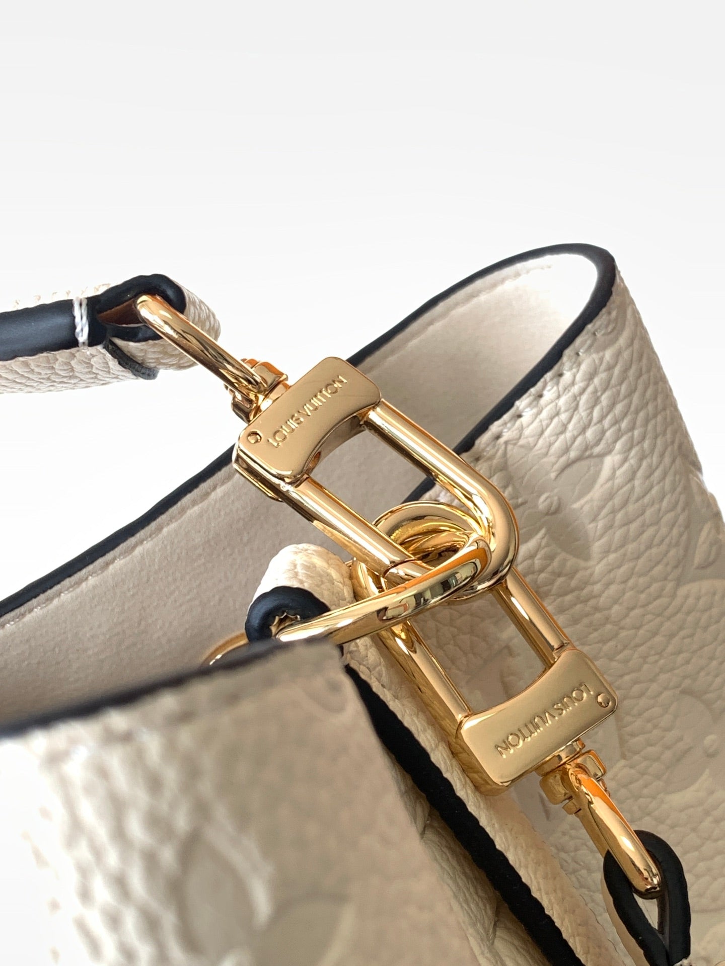 Louis Vuitton Elegant Cream Perforated Leather Drawstring Bucket Bag