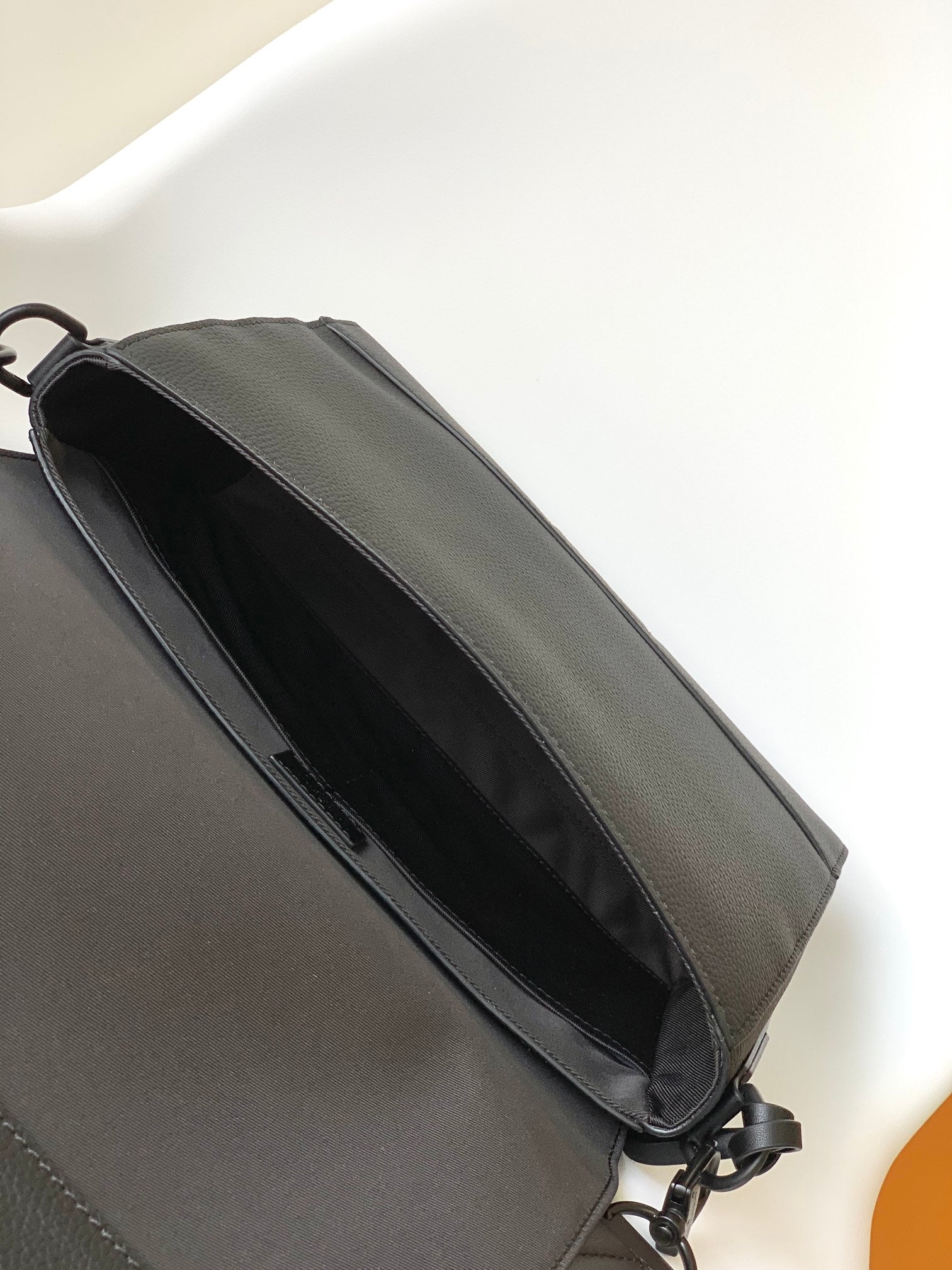 Louis Vuitton Minimalist Black Leather Messenger Bag with Wide Crossbody Strap