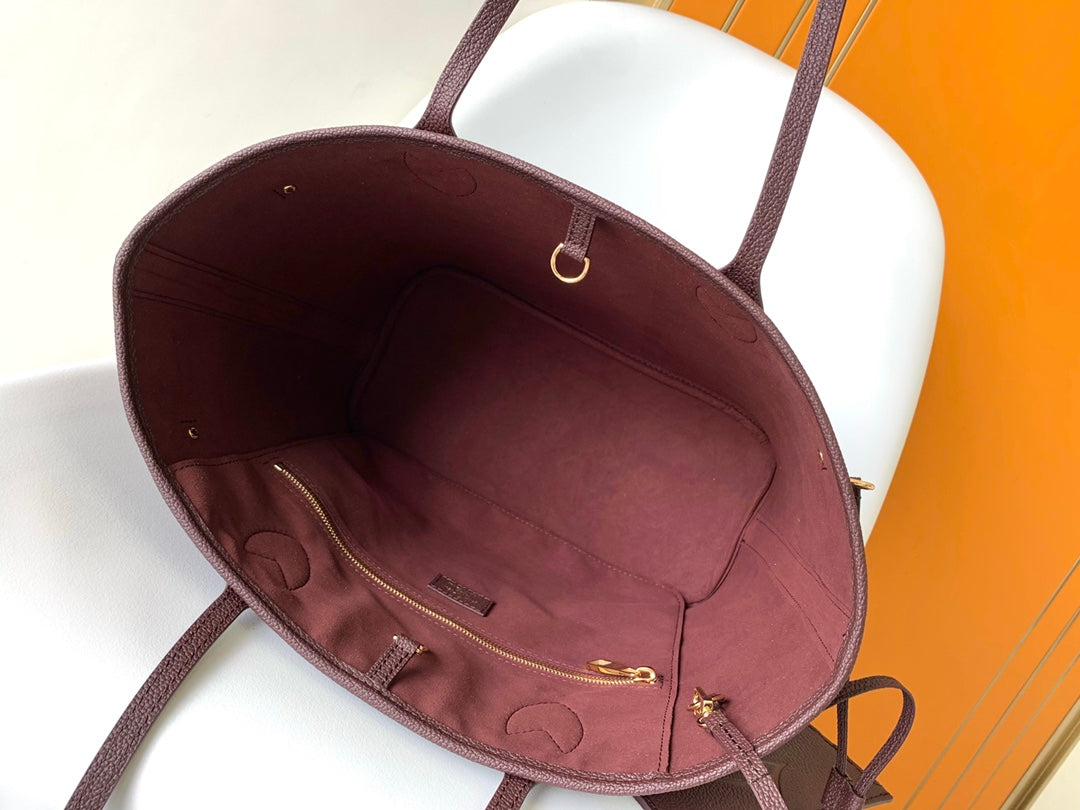 Louis Vuitton Elegant Burgundy Embossed Leather Tote Bag with Side Drawstrings
