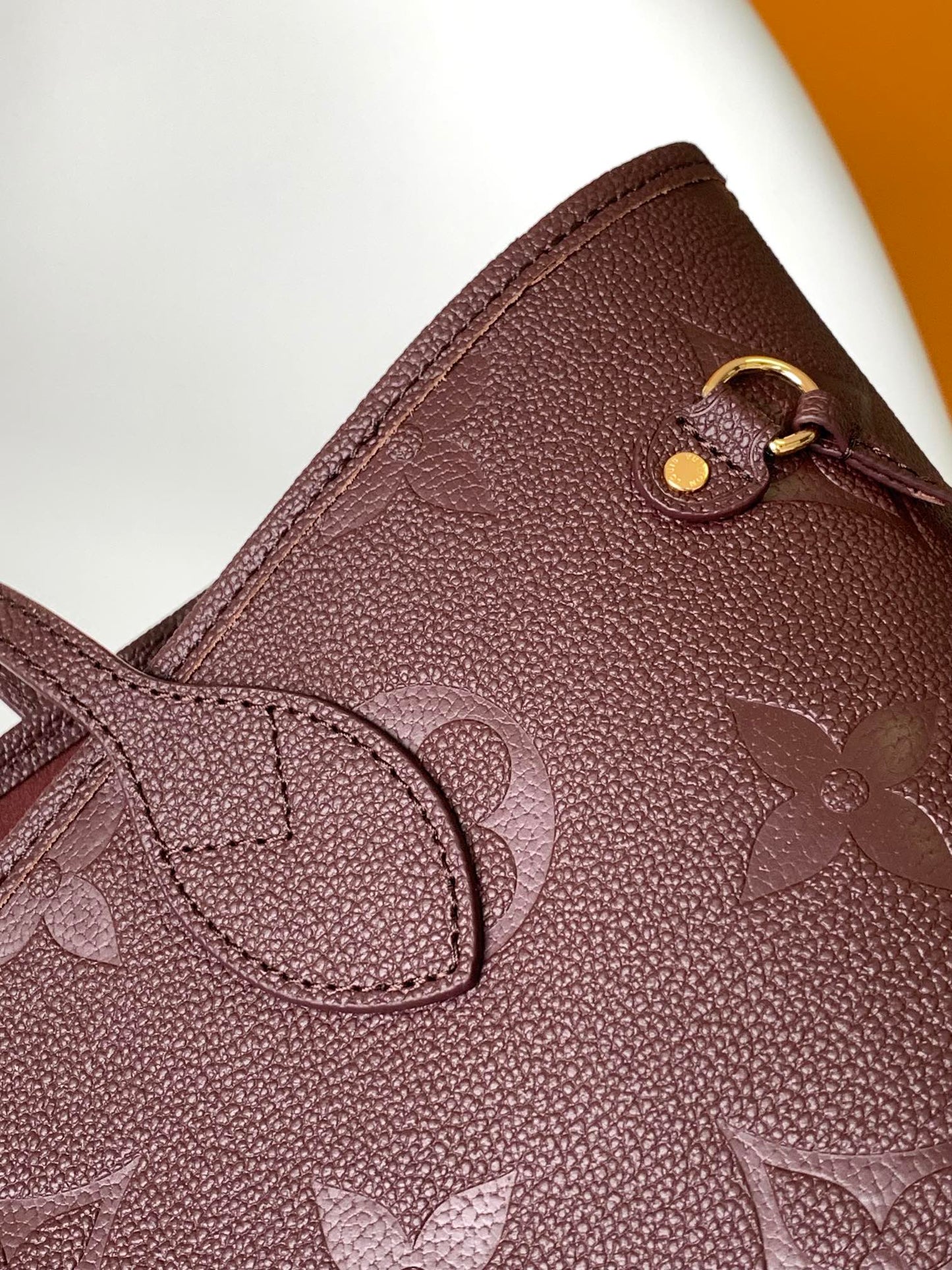 Louis Vuitton Elegant Burgundy Embossed Leather Tote Bag with Side Drawstrings