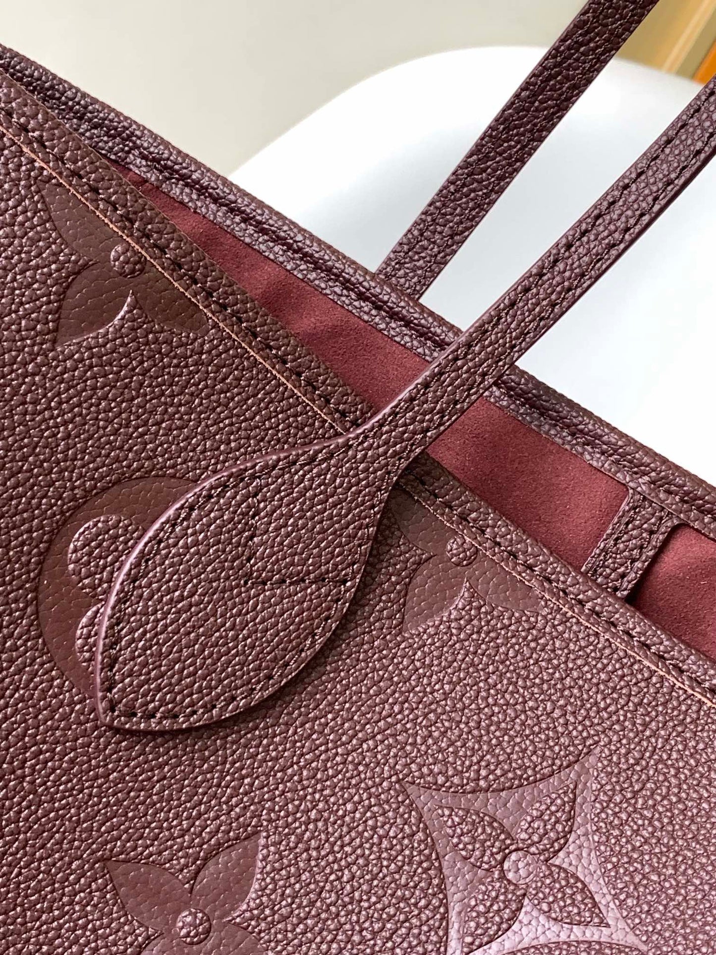 Louis Vuitton Elegant Burgundy Embossed Leather Tote Bag with Side Drawstrings
