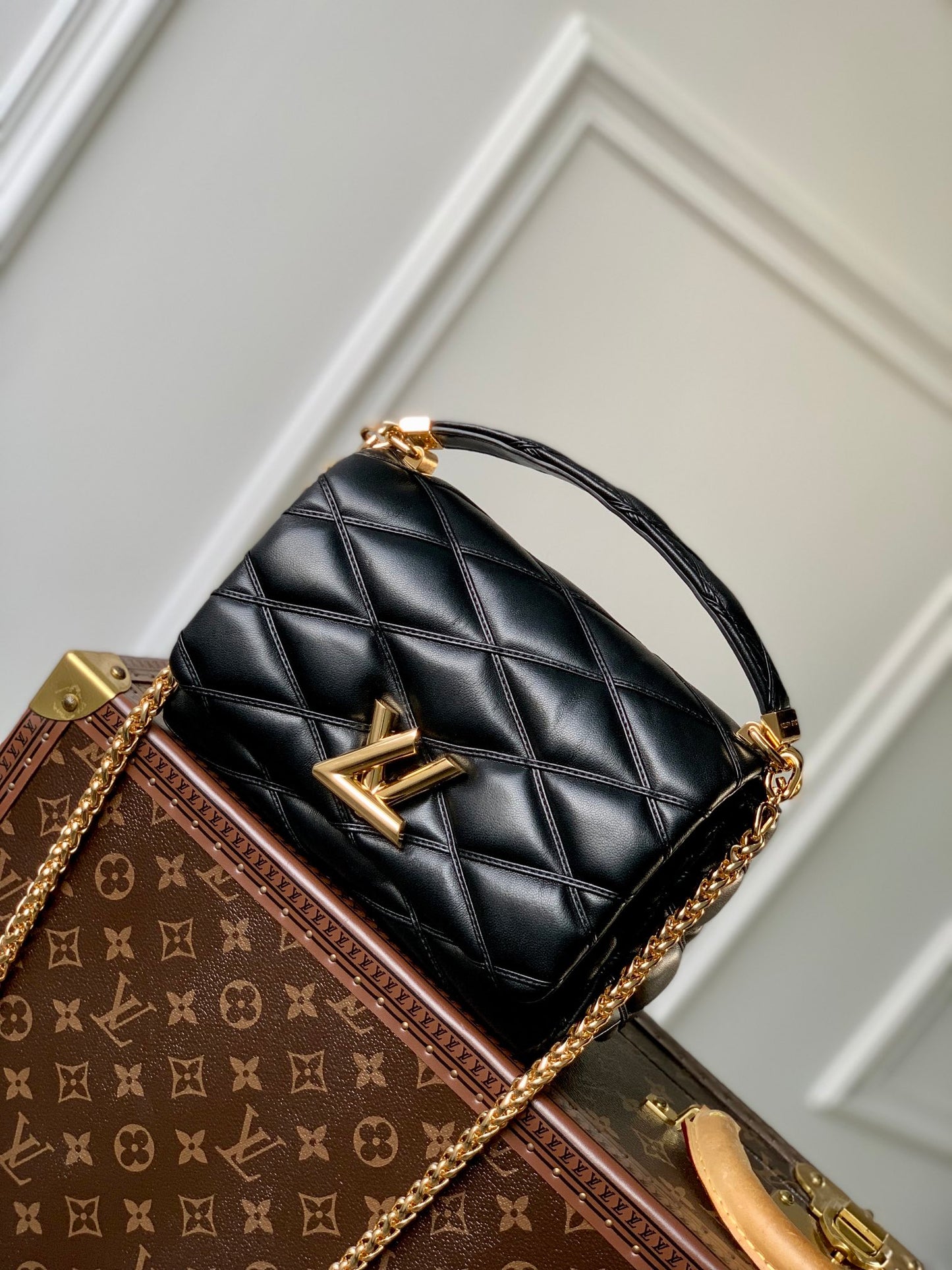 Louis Vuitton Quilted Black Leather Top Handle Handbag with Gold Metal Clasp