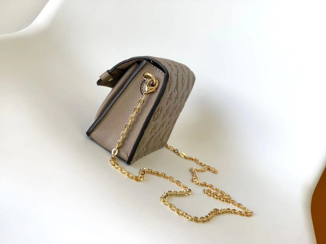 Louis Vuitton Elegant Taupe Embossed Leather Flap Handbag with Gold Chain Strap