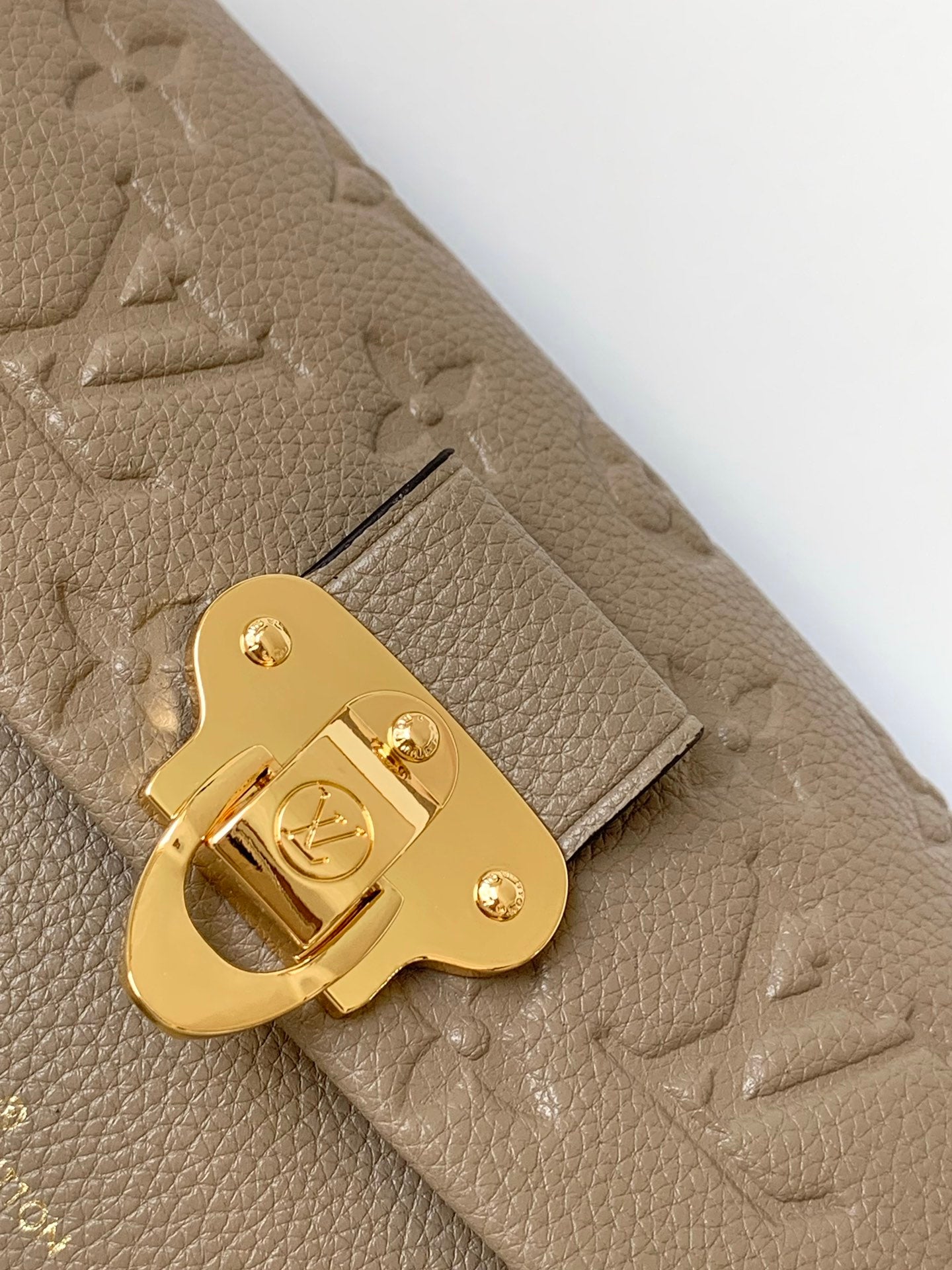 Louis Vuitton Elegant Taupe Embossed Leather Flap Handbag with Gold Chain Strap