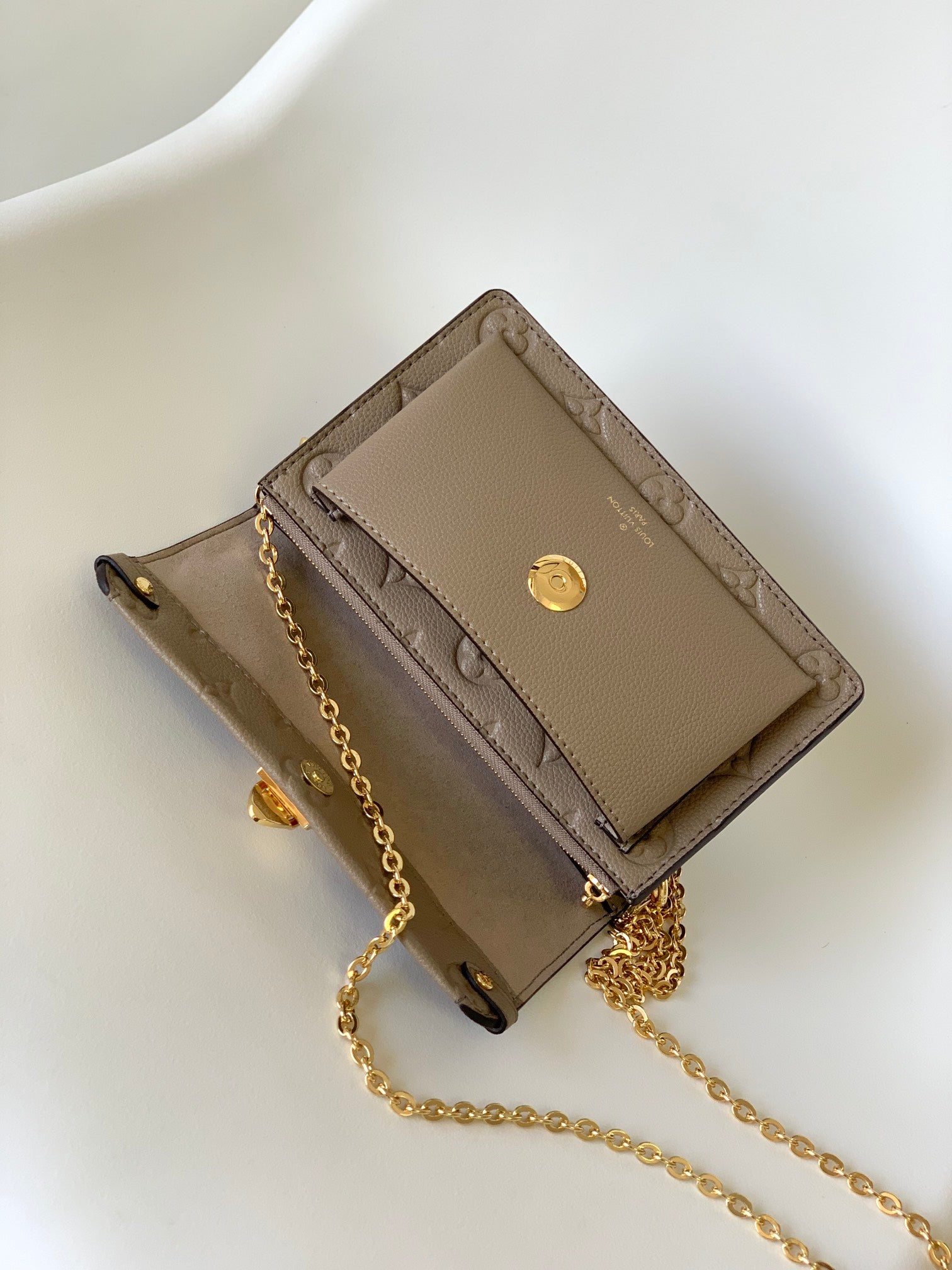 Louis Vuitton Elegant Taupe Embossed Leather Flap Handbag with Gold Chain Strap