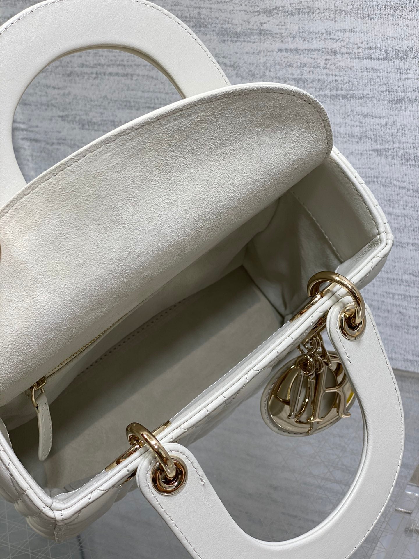 Dior White Quilted Leather Handbag with Gold Charms and Wide Strap