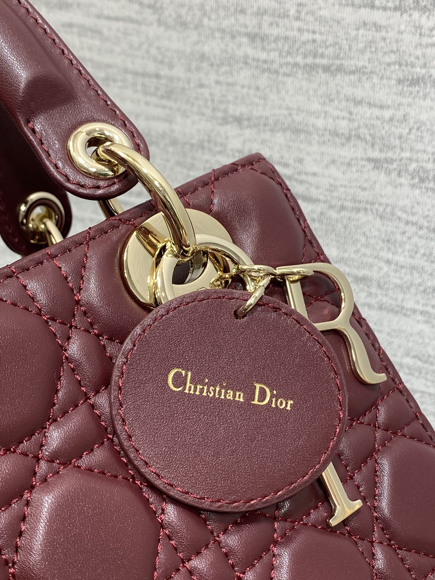 Dior Burgundy Quilted Leather Top Handle Handbag with Crossbody Strap