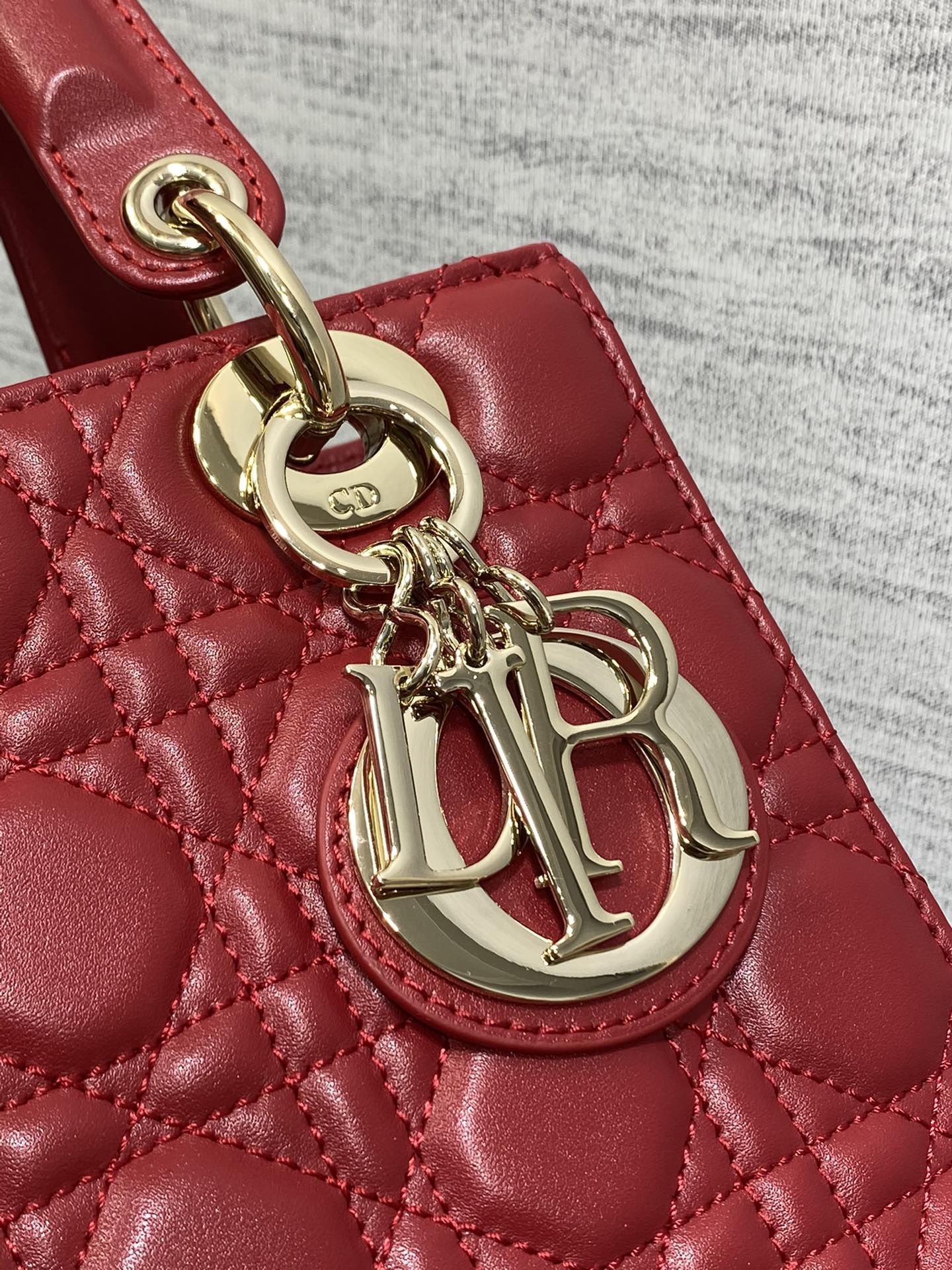 Dior Red Quilted Leather Top Handle Bag with Gold Charms and Crossbody Strap