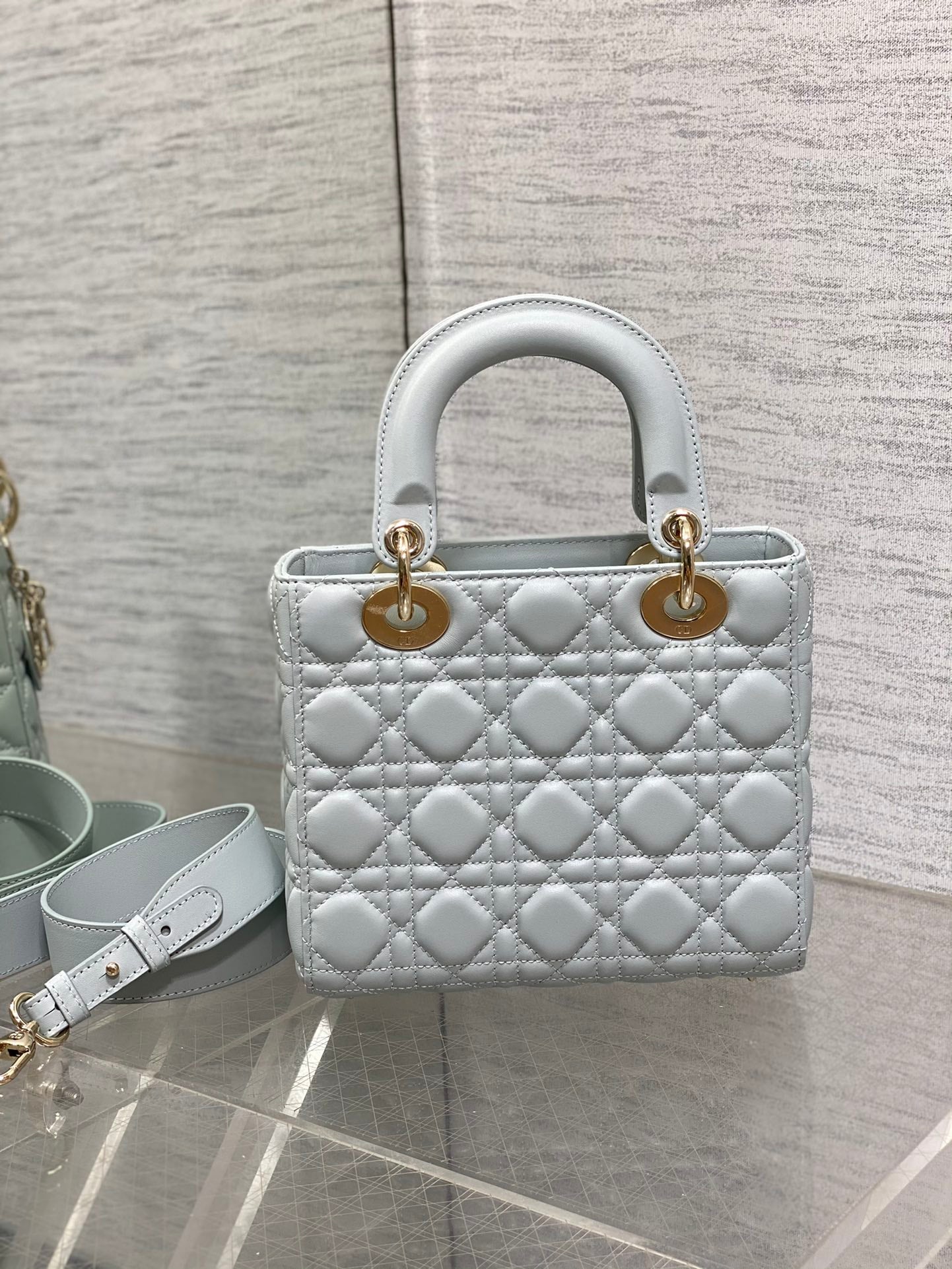 Dior Light Blue Quilted Leather Handbag with Gold Charms and Strap