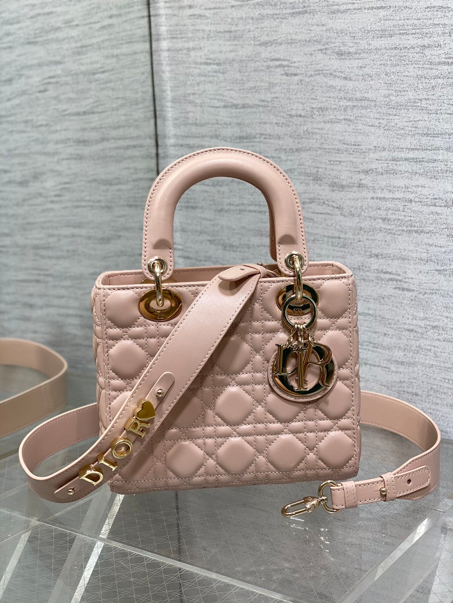 Dior Luxury Quilted Pale Pink Leather Handbag with Gold Hardware and Strap