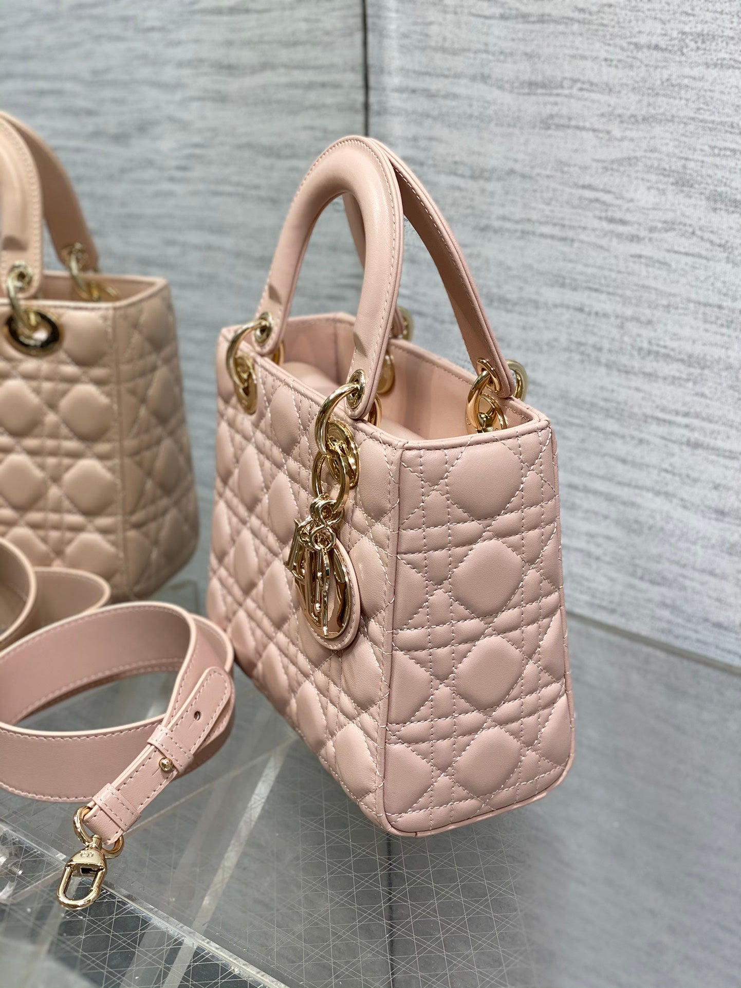 Dior Luxury Quilted Pale Pink Leather Handbag with Gold Hardware and Strap