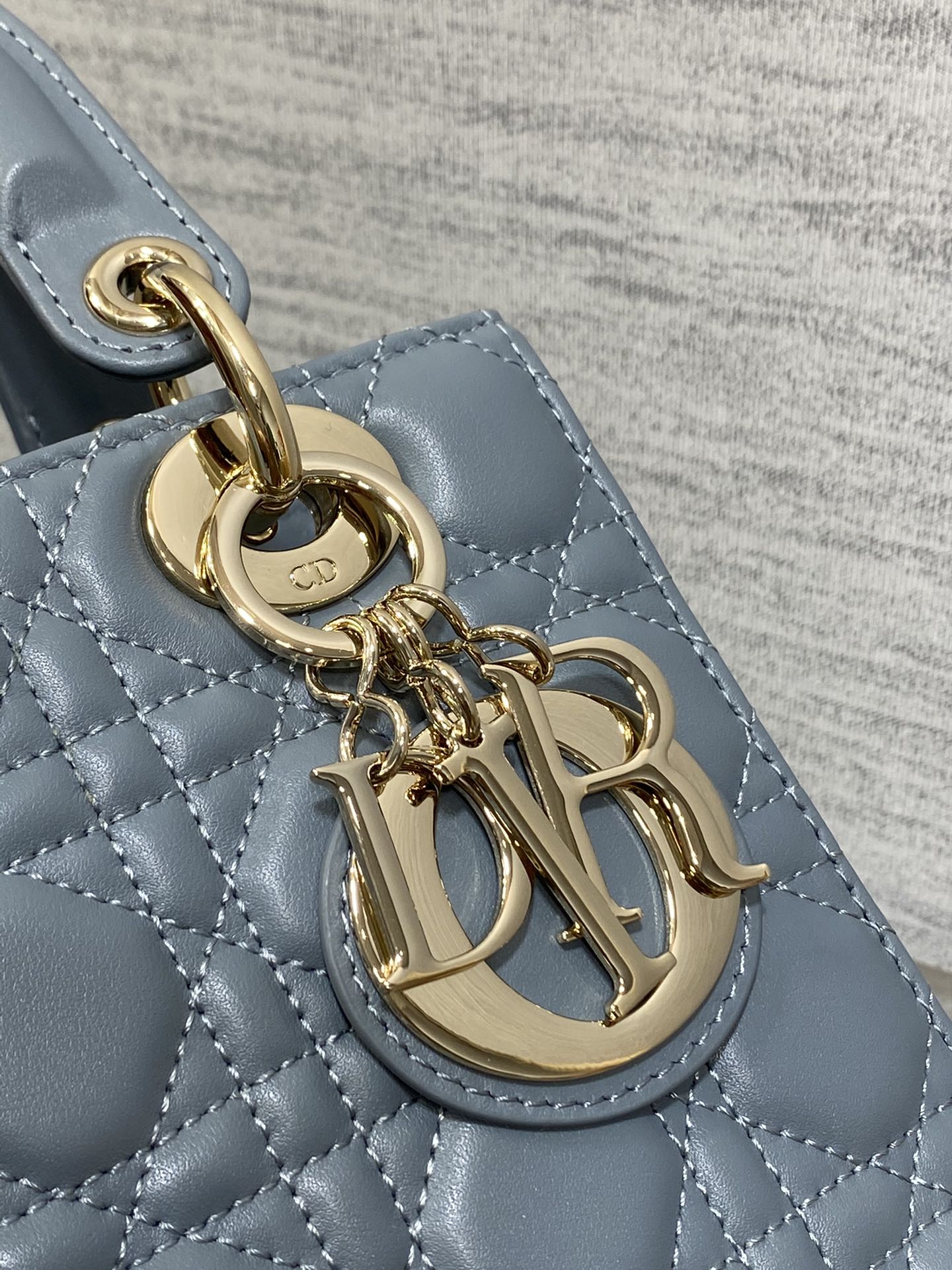 Dior Elegant Dusty Blue Quilted Leather Handbag with Top Handle