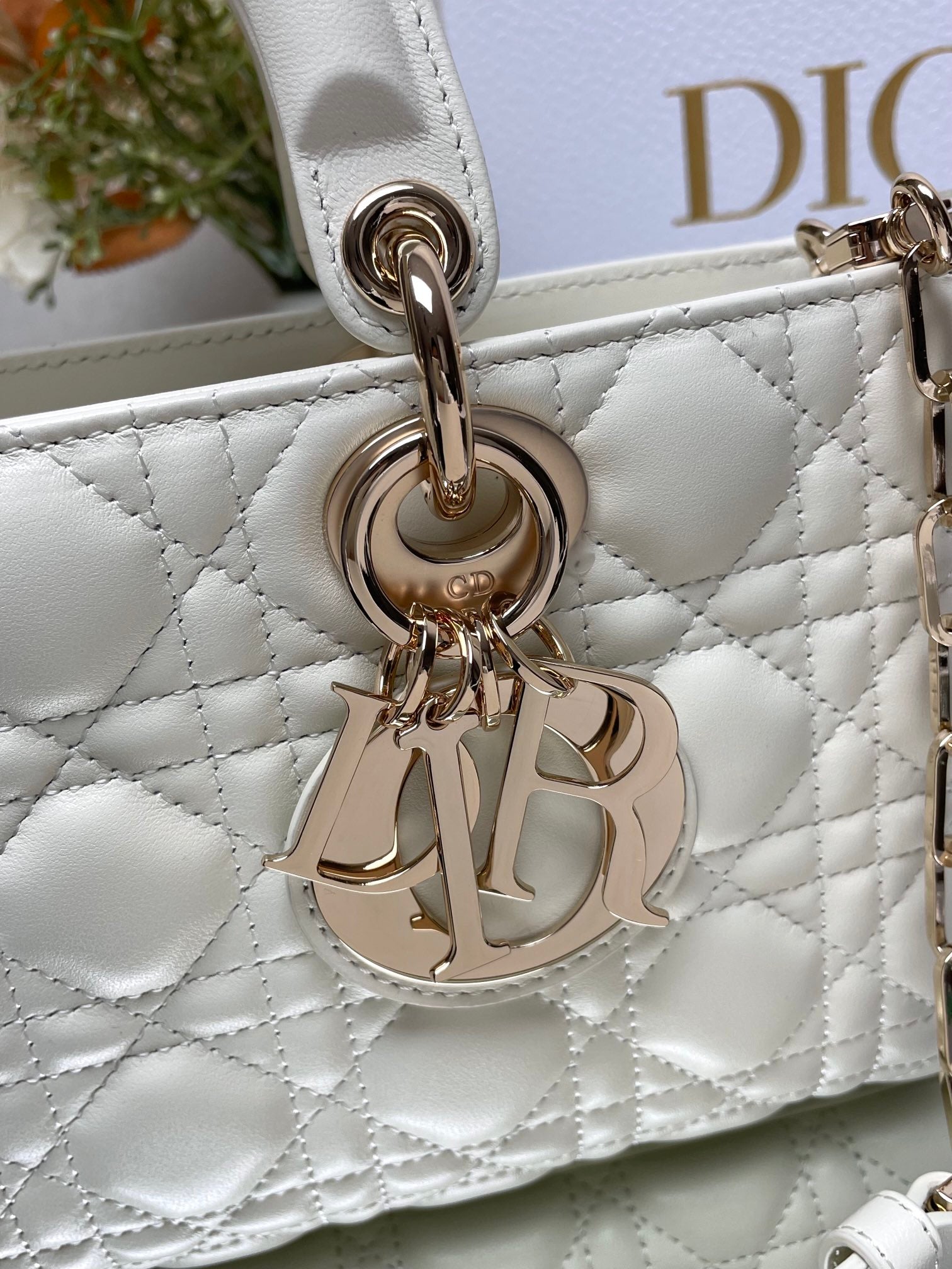 Dior Elegant White Quilted Leather Top Handle Bag with Gold Chain Strap