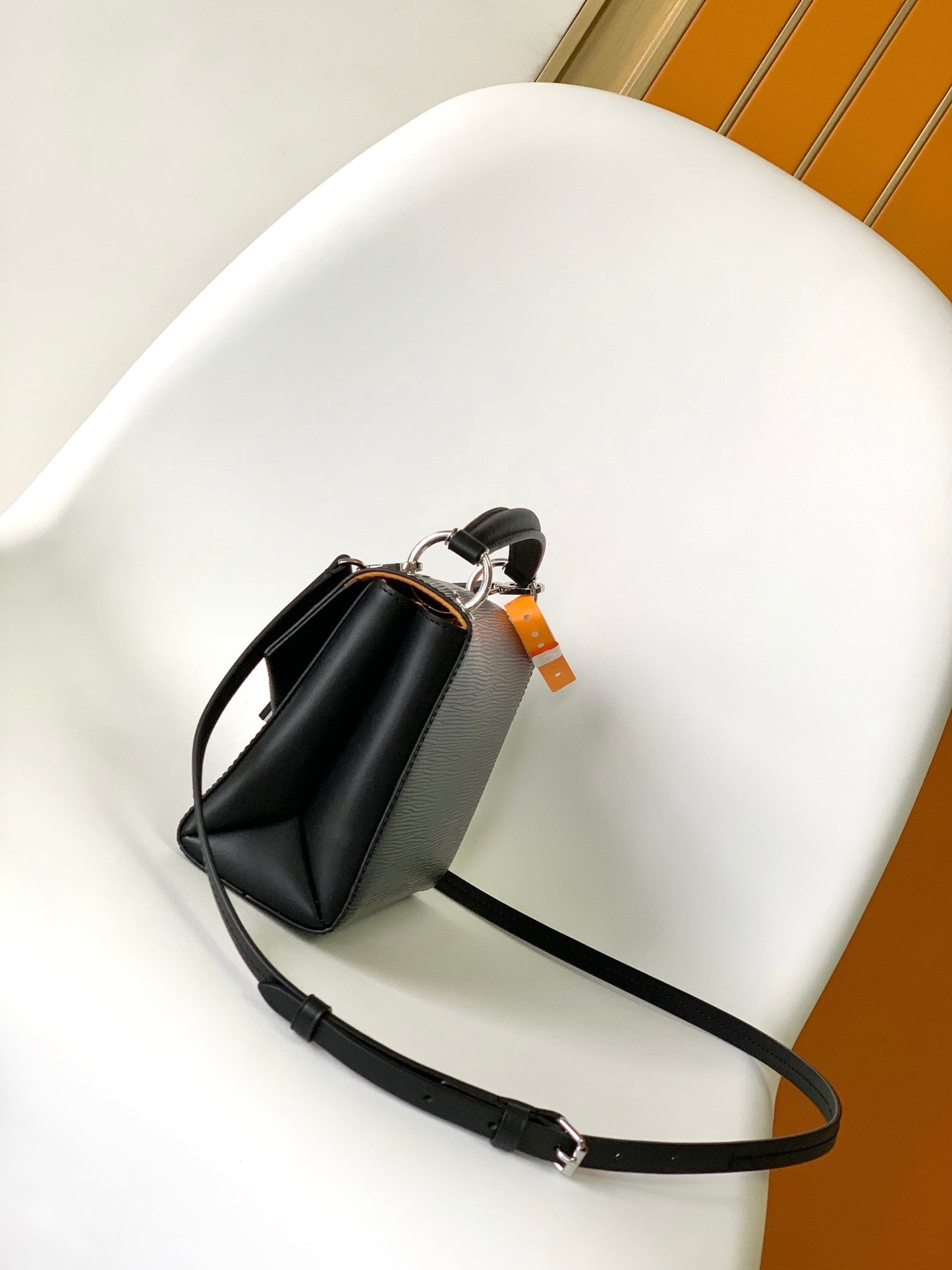 Louis Vuitton Elegant Black Textured Leather Crossbody Bag with Top Handle