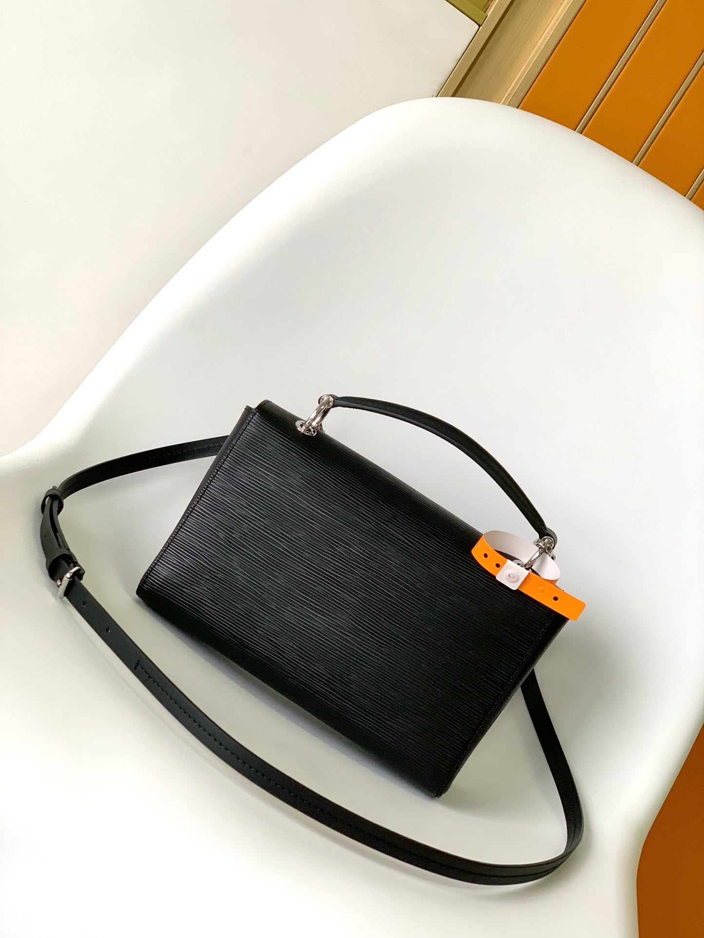 Louis Vuitton Elegant Black Textured Leather Crossbody Bag with Top Handle