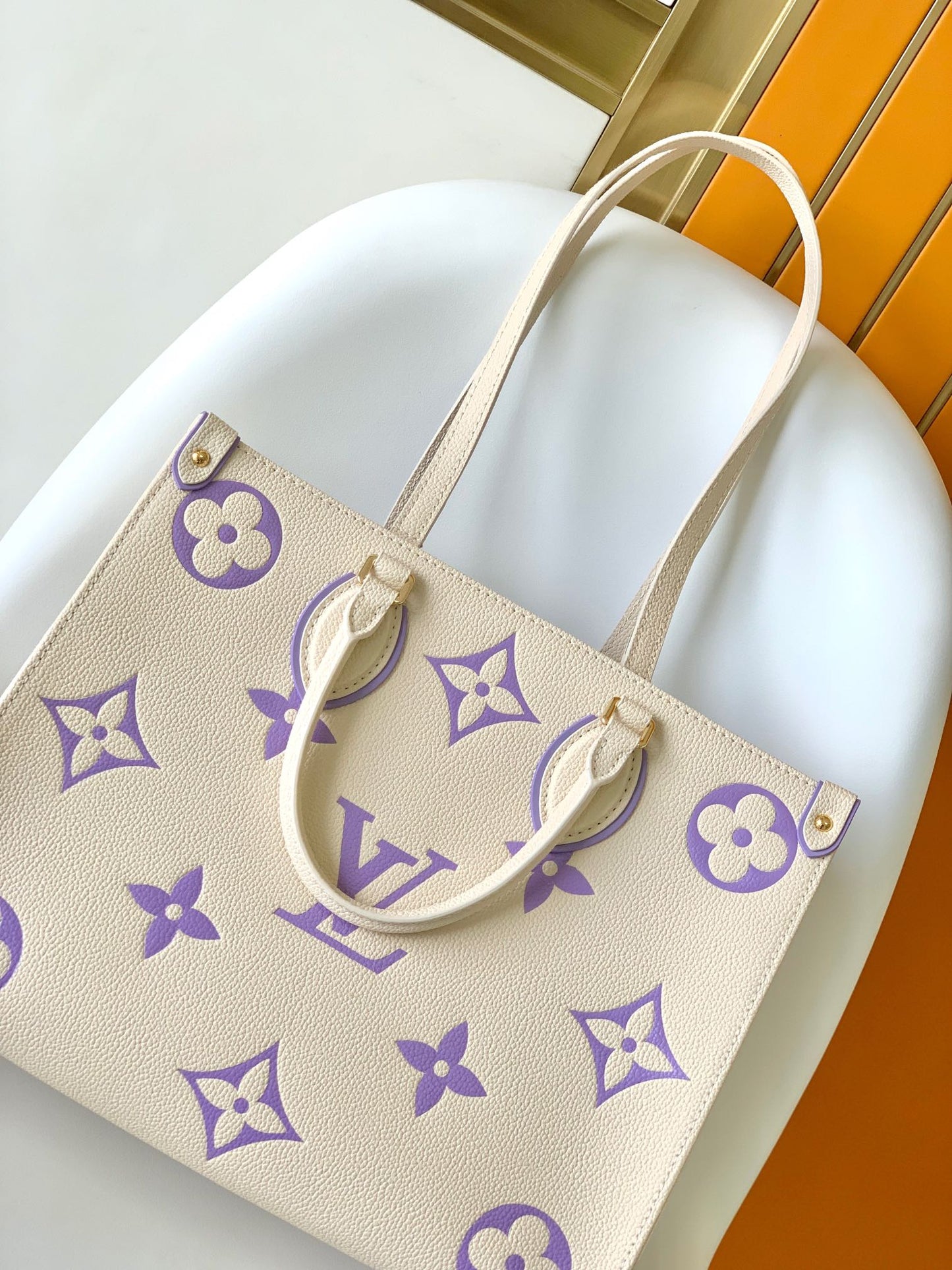 Louis Vuitton Elegant Cream Leather Tote Bag with Purple Monogram Print