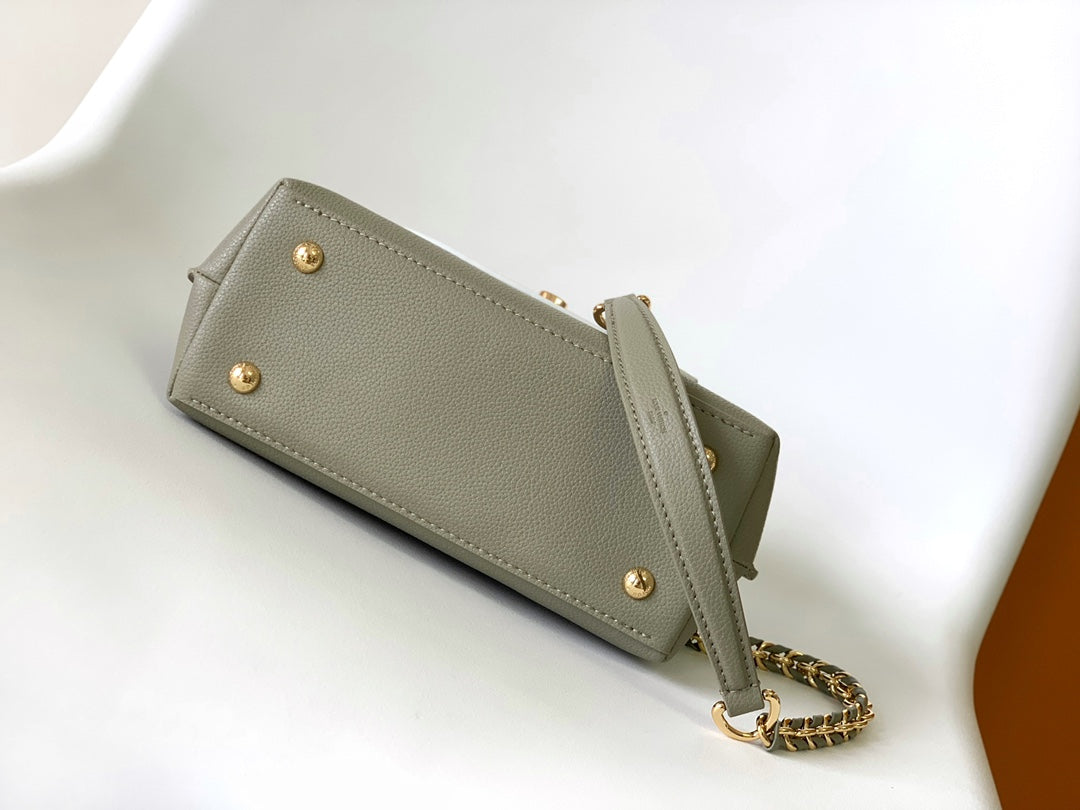 Louis Vuitton Elegant Sage Green and Cream Leather Top Handle Handbag with Gold Clasp