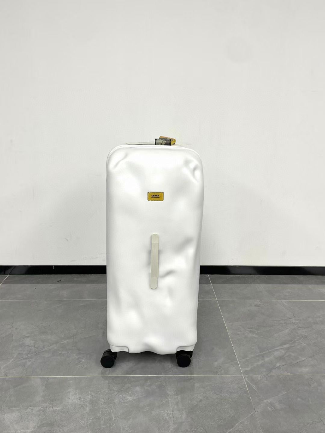 Modern Glossy White Dented Hardshell Spinner Suitcase