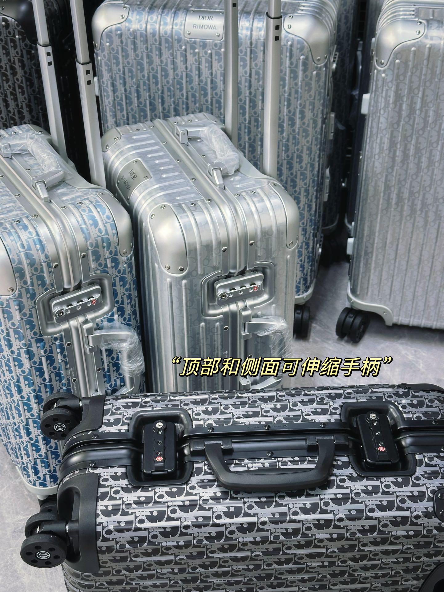 Silver Aluminum Hardside Spinner Suitcase with Monogram Pattern