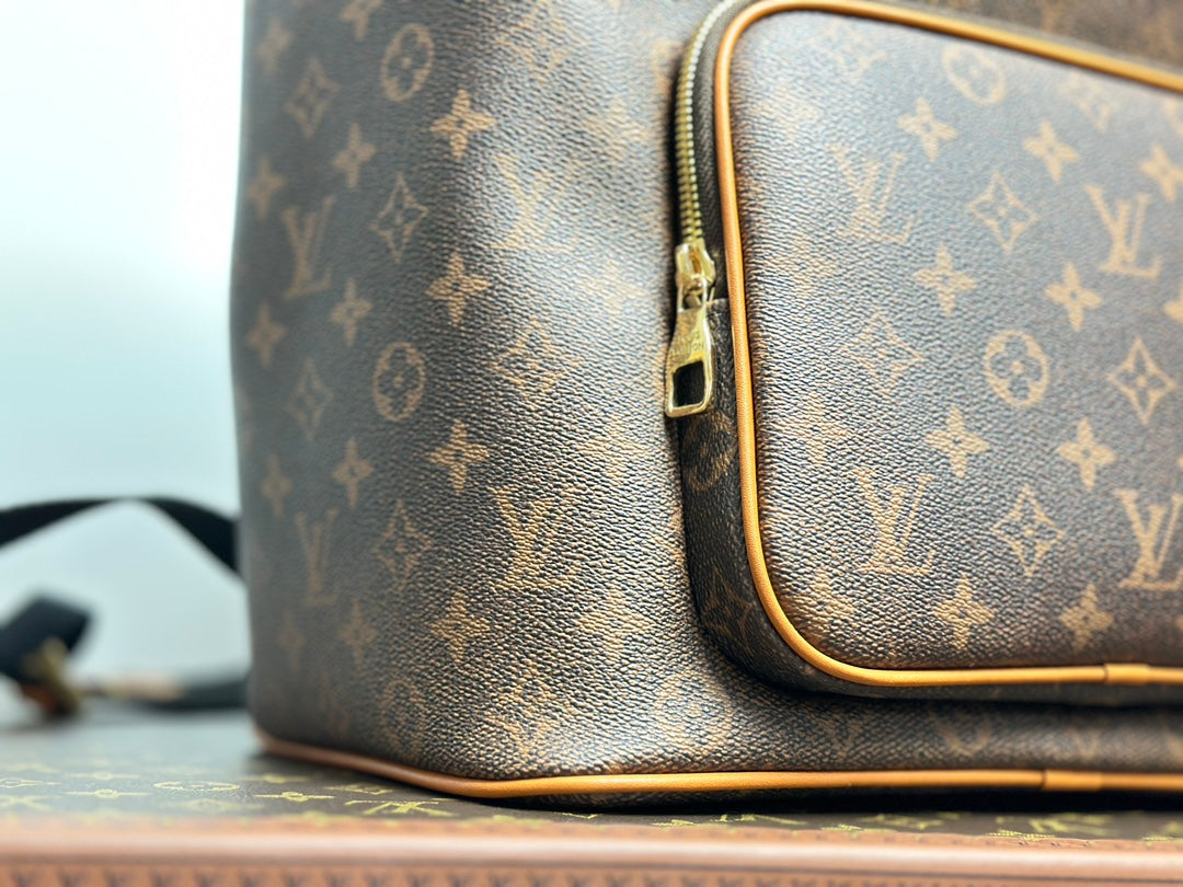 Louis Vuitton Vintage Monogram Pattern Leather Backpack with Buckle and Tassel