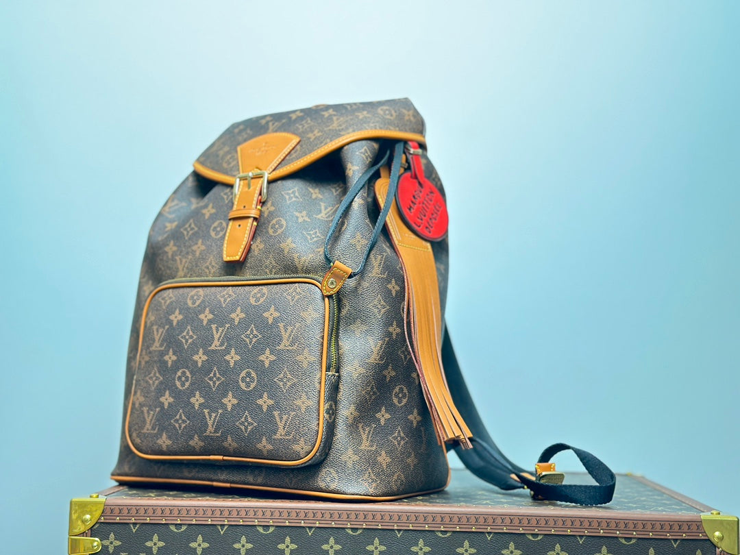 Louis Vuitton Vintage Monogram Pattern Leather Backpack with Buckle and Tassel