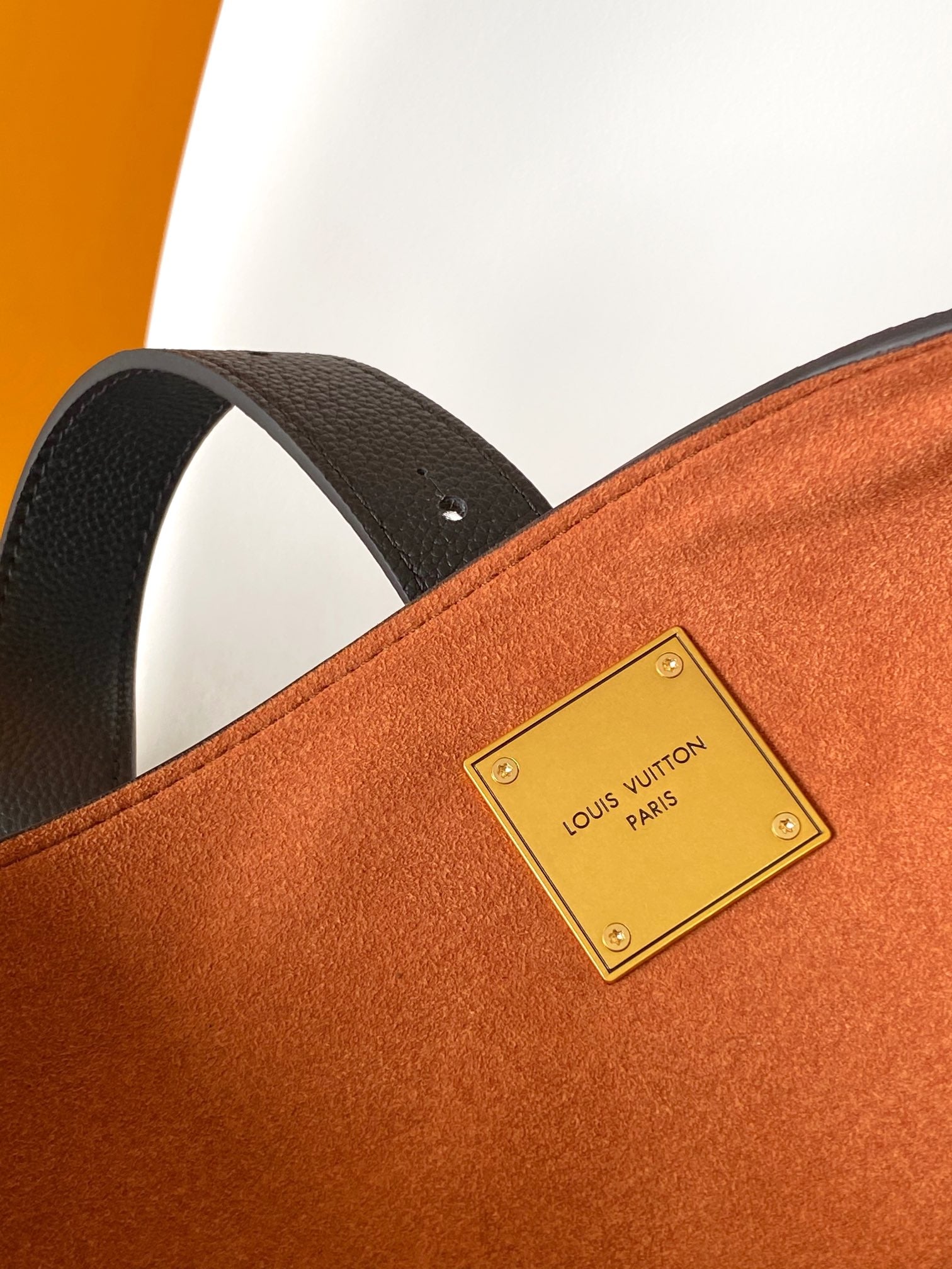 Louis Vuitton Classic Brown Leather Tote Bag with Gold Lock Accent and Shoulder Straps