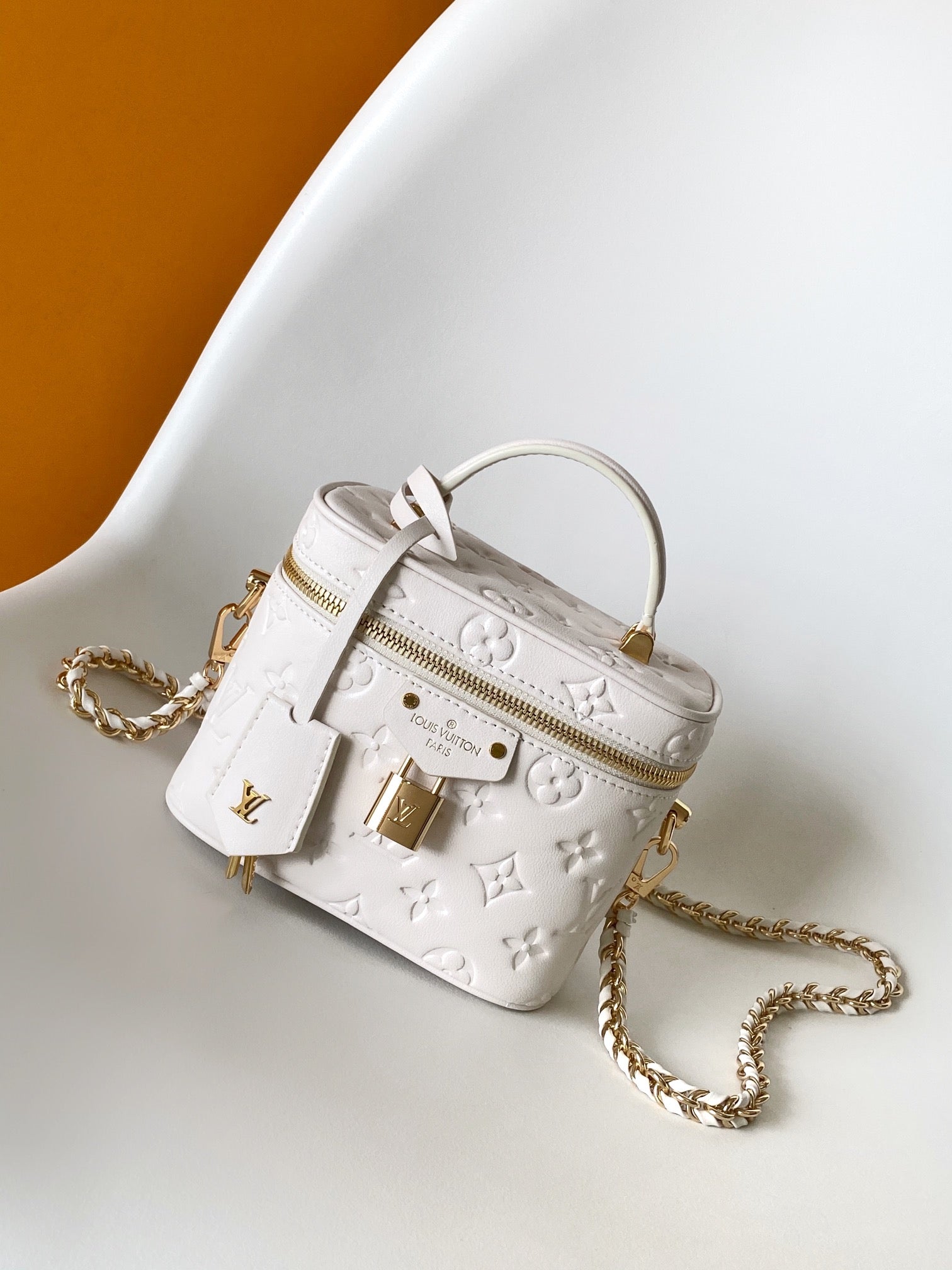 Louis Vuitton Elegant Off-White Embossed Leather Vanity Case Handbag
