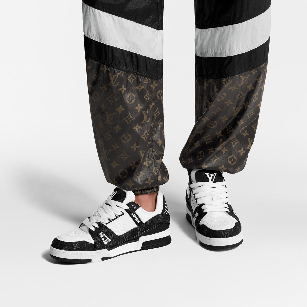 Louis Vuitton LV Trainer Maxi sneaker in black and white monogram denim and leather.
