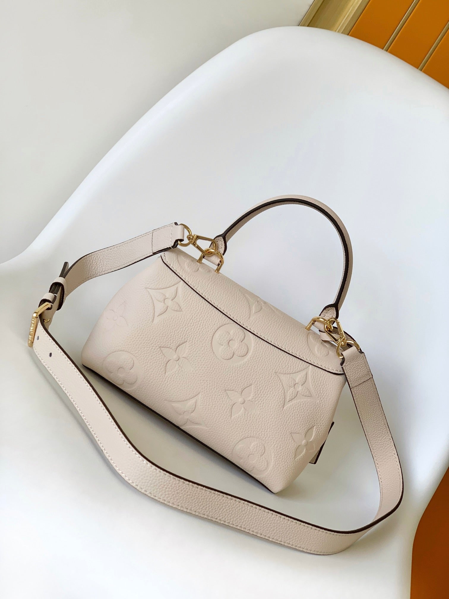 Louis Vuitton Elegant Cream Embossed Leather Top Handle Handbag with Shoulder Strap