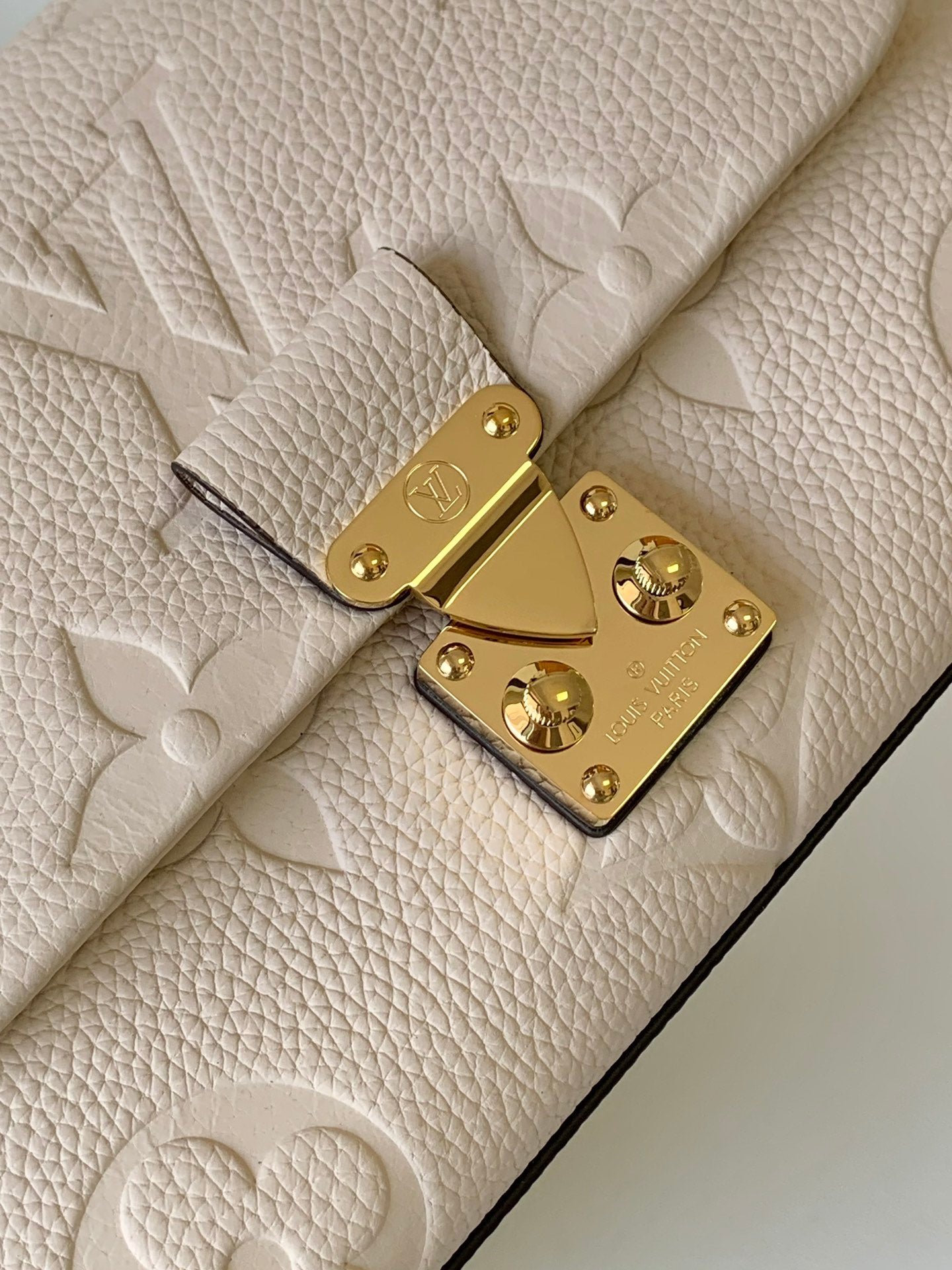 Louis Vuitton Elegant Cream Embossed Leather Top Handle Handbag with Shoulder Strap