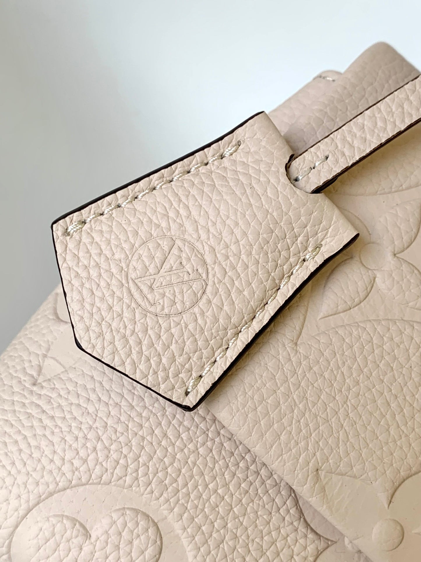 Louis Vuitton Elegant Cream Embossed Leather Top Handle Handbag with Shoulder Strap