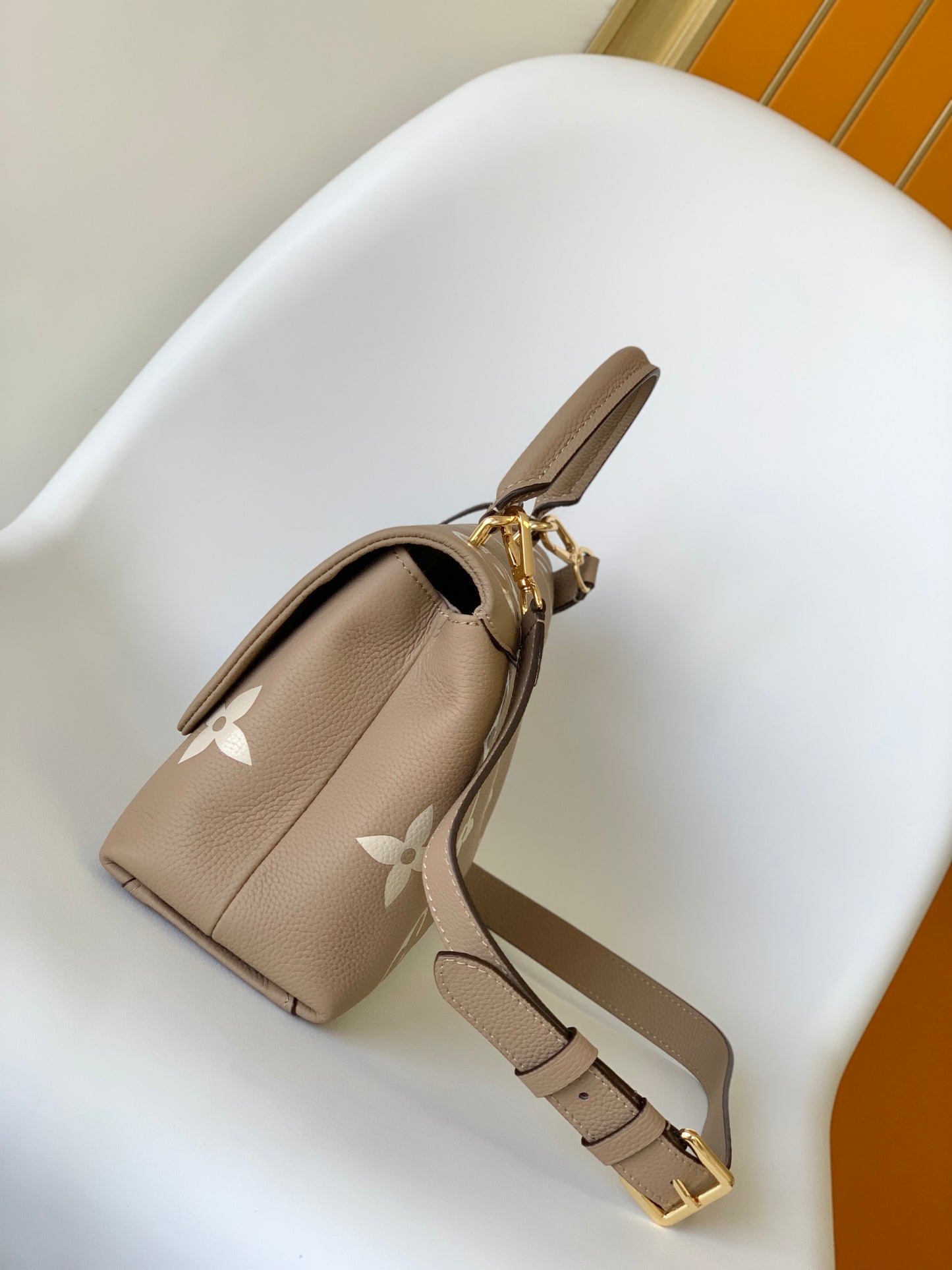 Louis Vuitton Elegant Beige Monogram Embossed Leather Top Handle Handbag