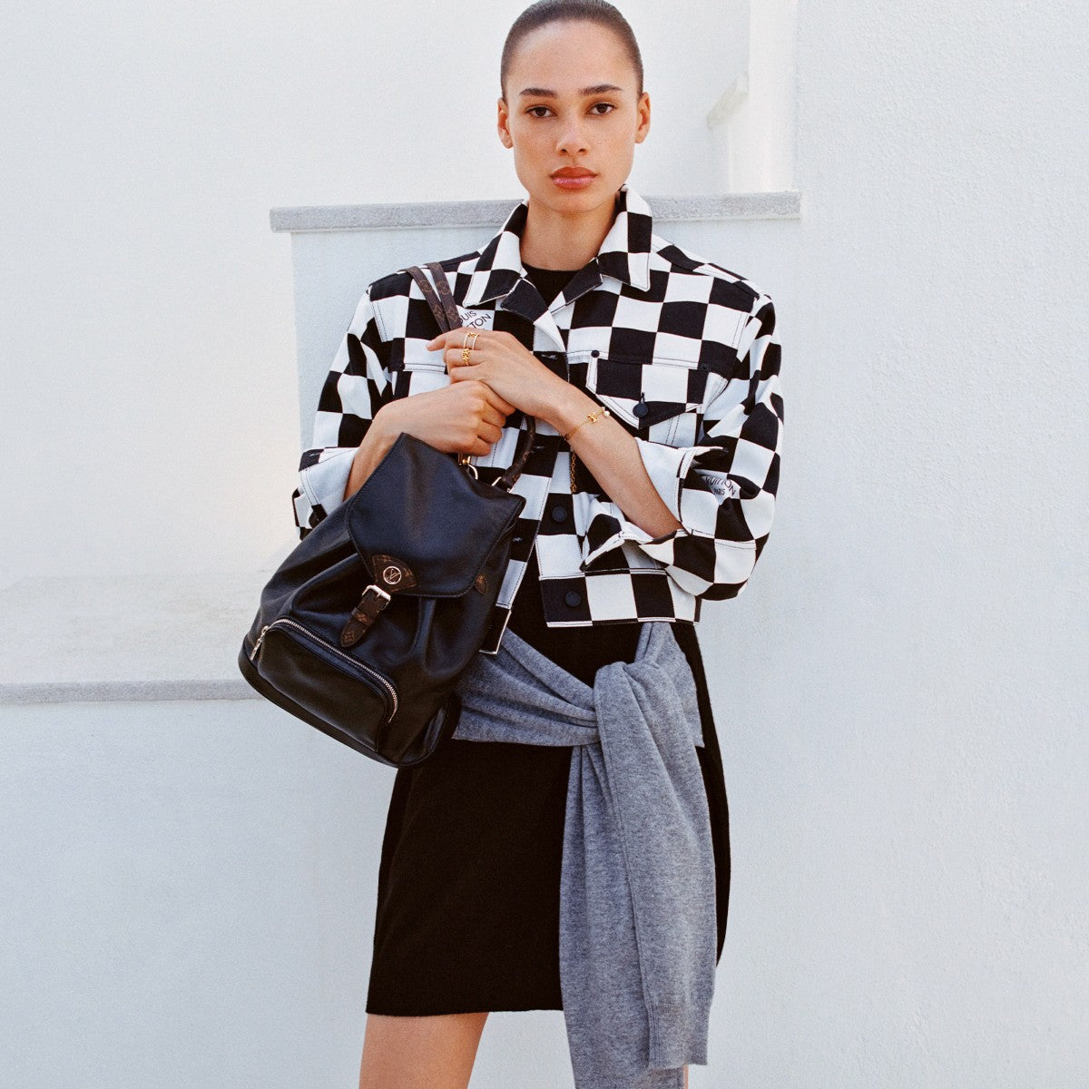Louis Vuitton Black Leather Drawstring Backpack with Silver Chain Accent