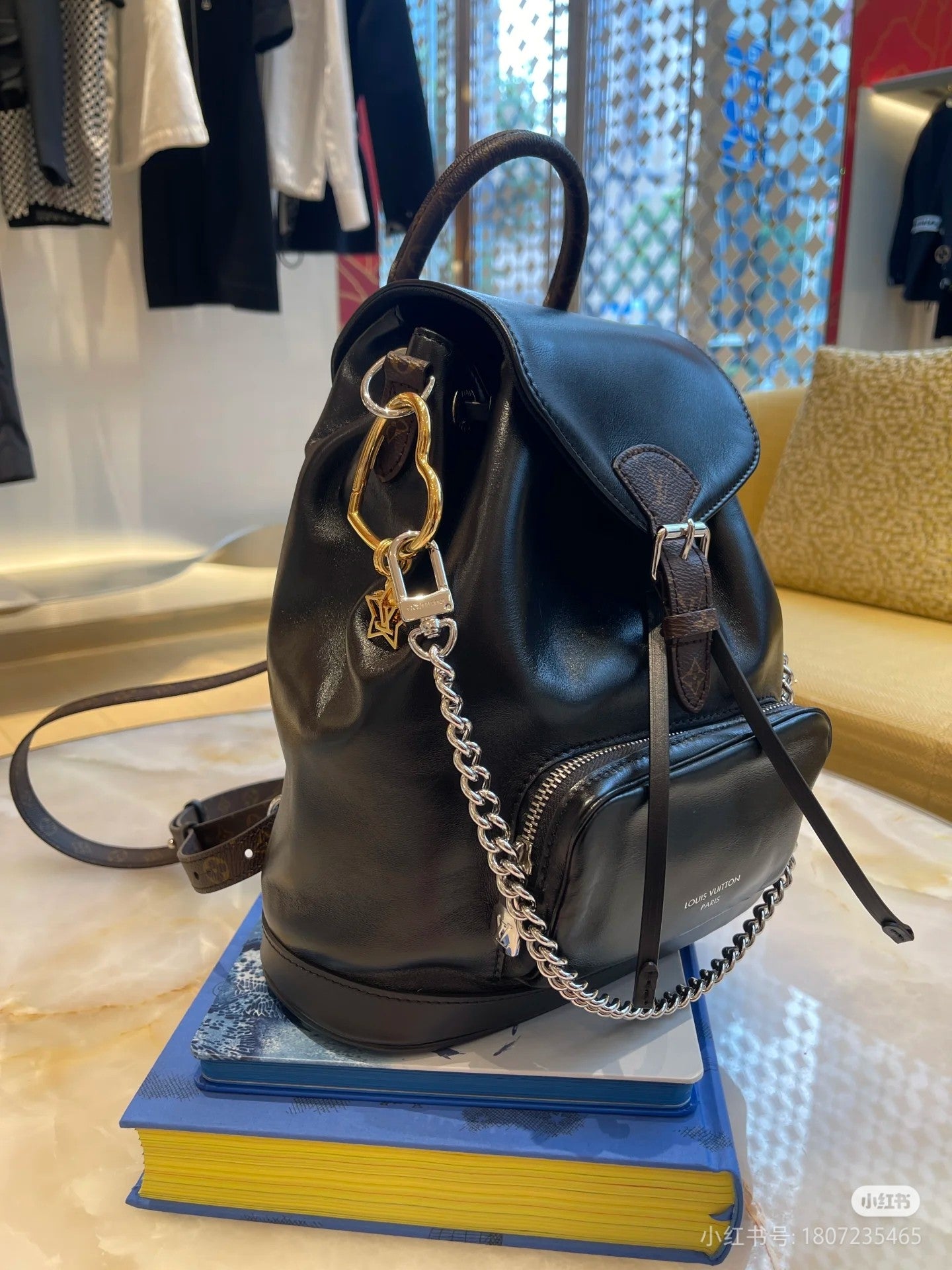 Louis Vuitton Black Leather Drawstring Backpack with Silver Chain Accent