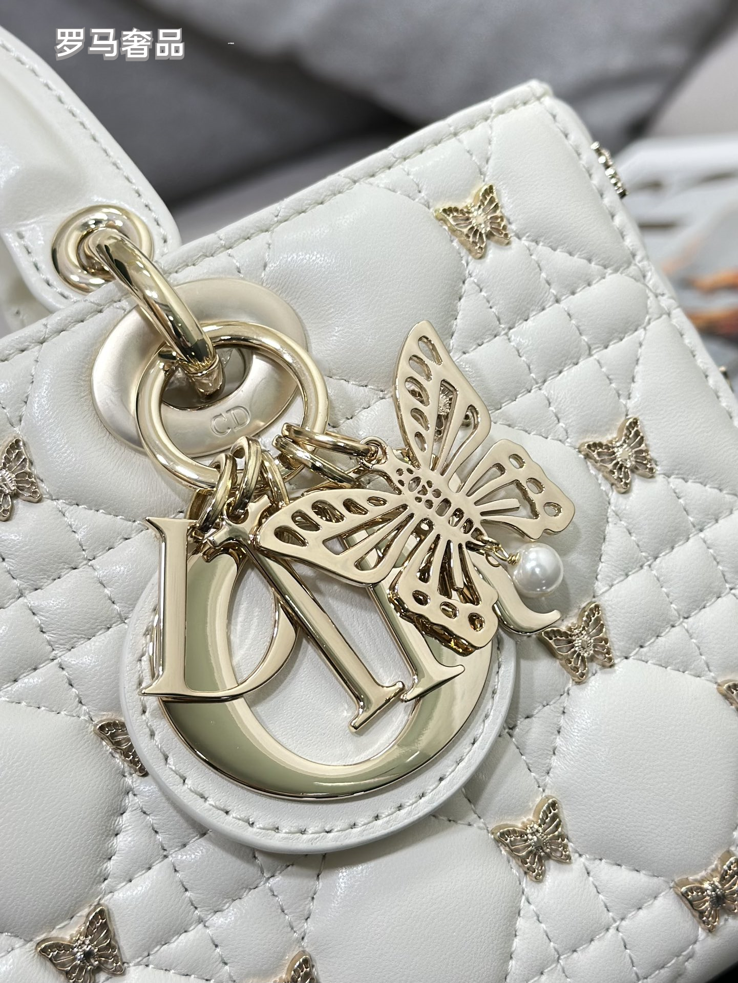 Dior Luxury Black Quilted Leather Top Handle Bag with Gold Butterfly Charm