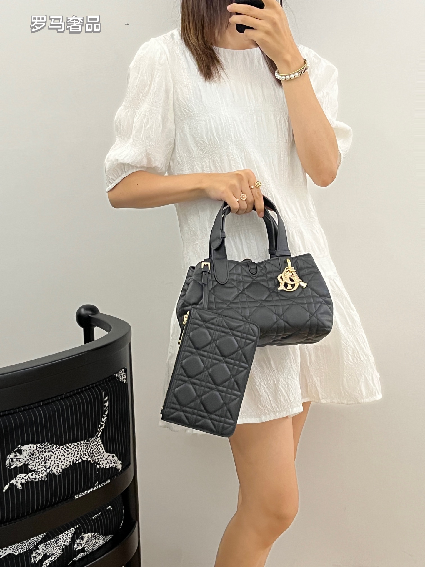 Dior Elegant Black Quilted Top Handle Handbag with Gold Letter Charms