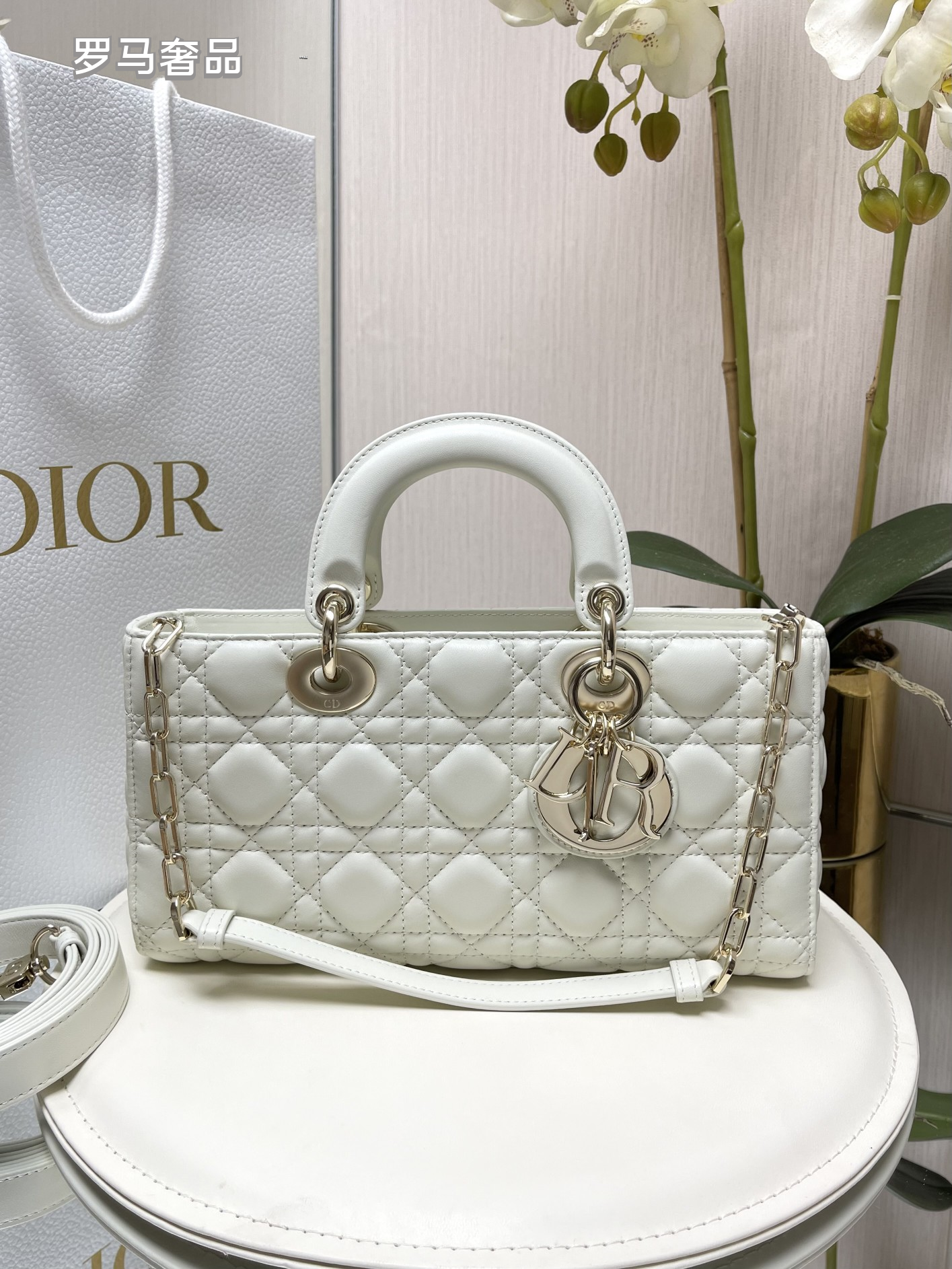 Dior Black Quilted Leather Handbag with Top Handle and Gold Chain Strap